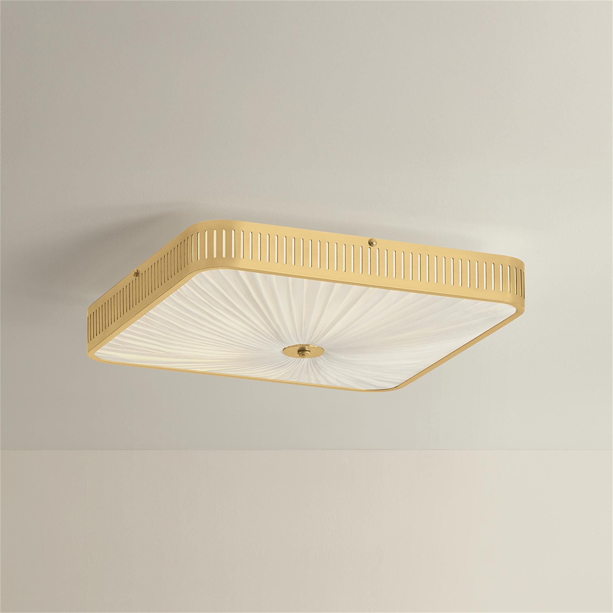 Shown in Aged Brass finish and Ivory Silk shade