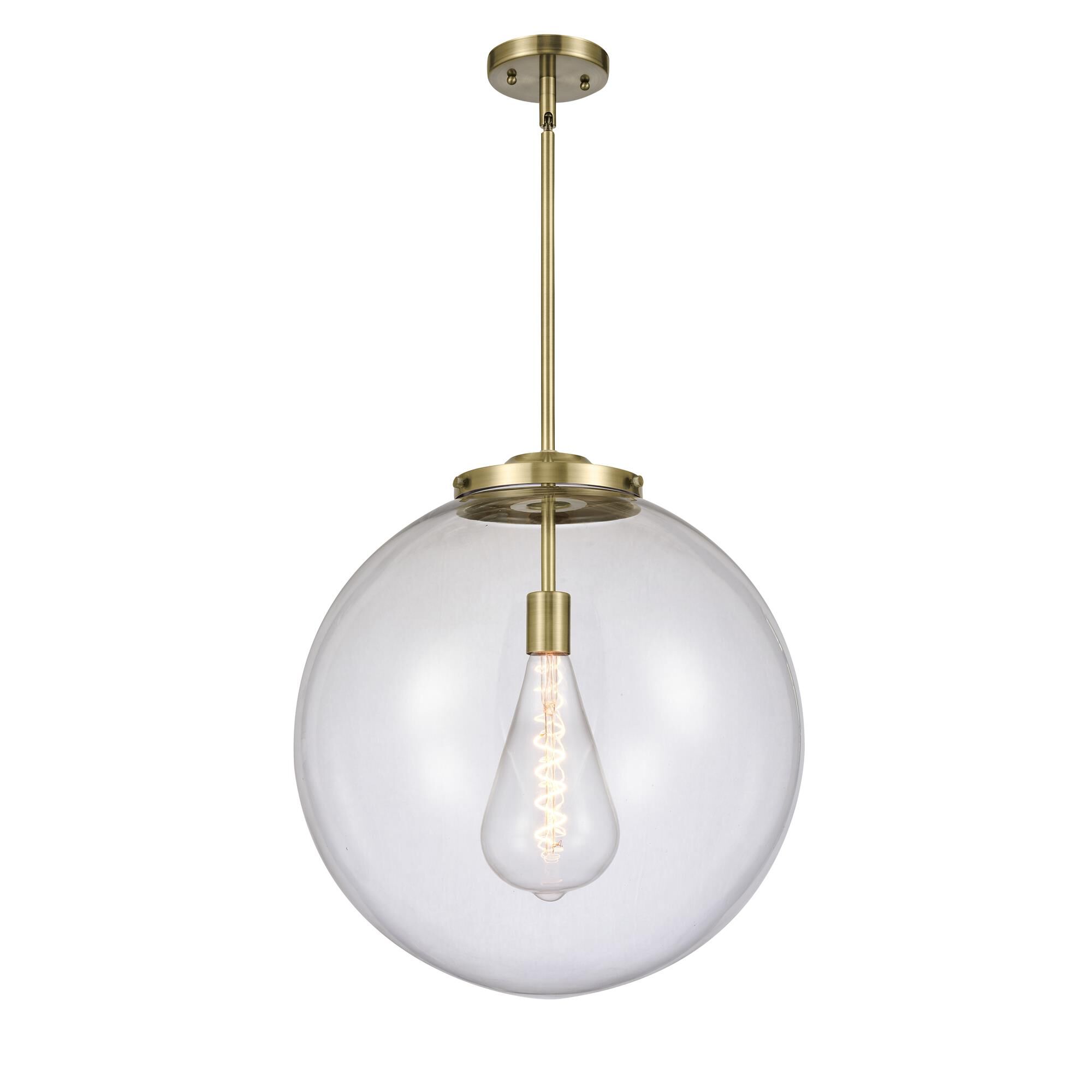 Shown in Antique Brass finish and Clear Beacon glass