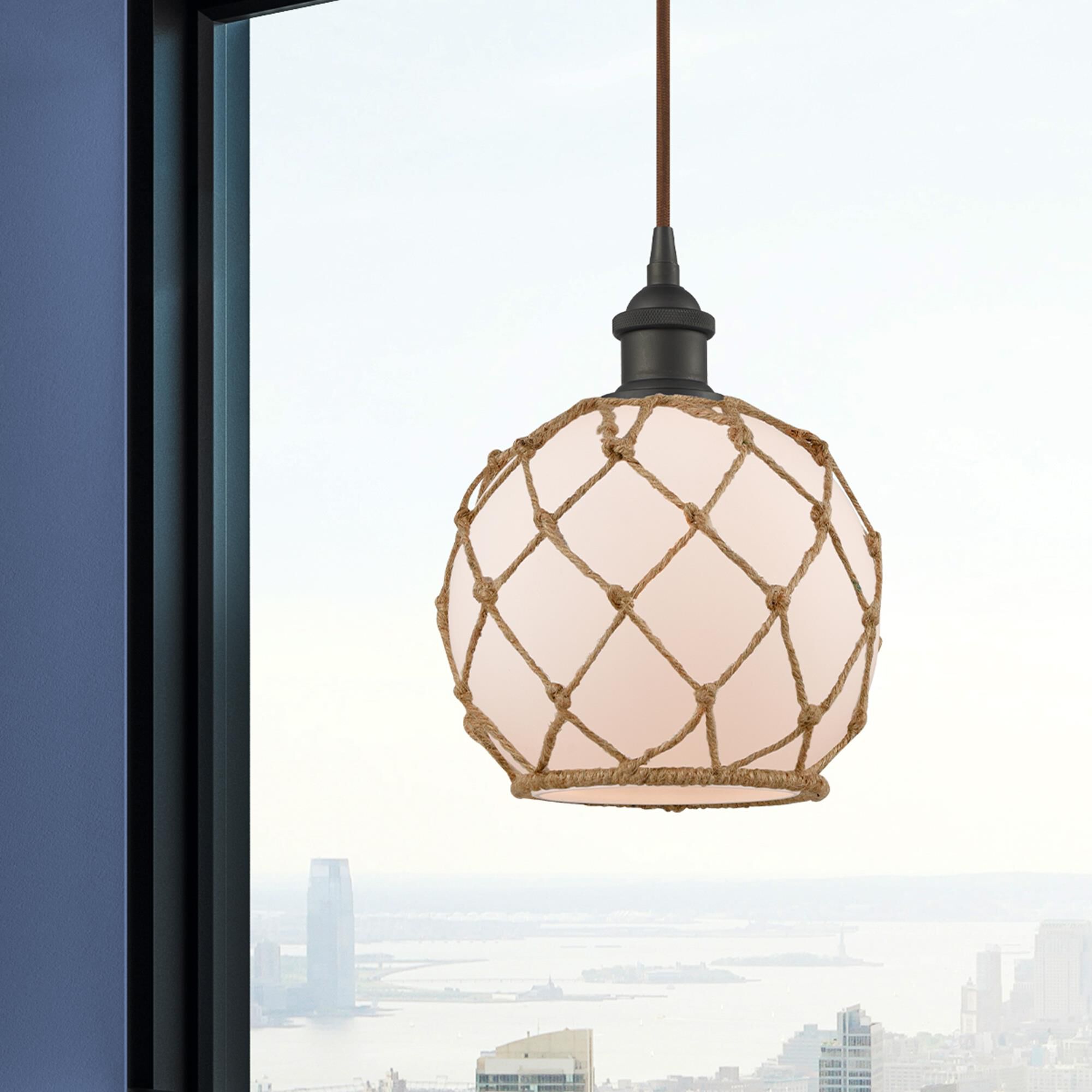 Shown in Oil Rubbed Bronze finish and White With Black Rope glass