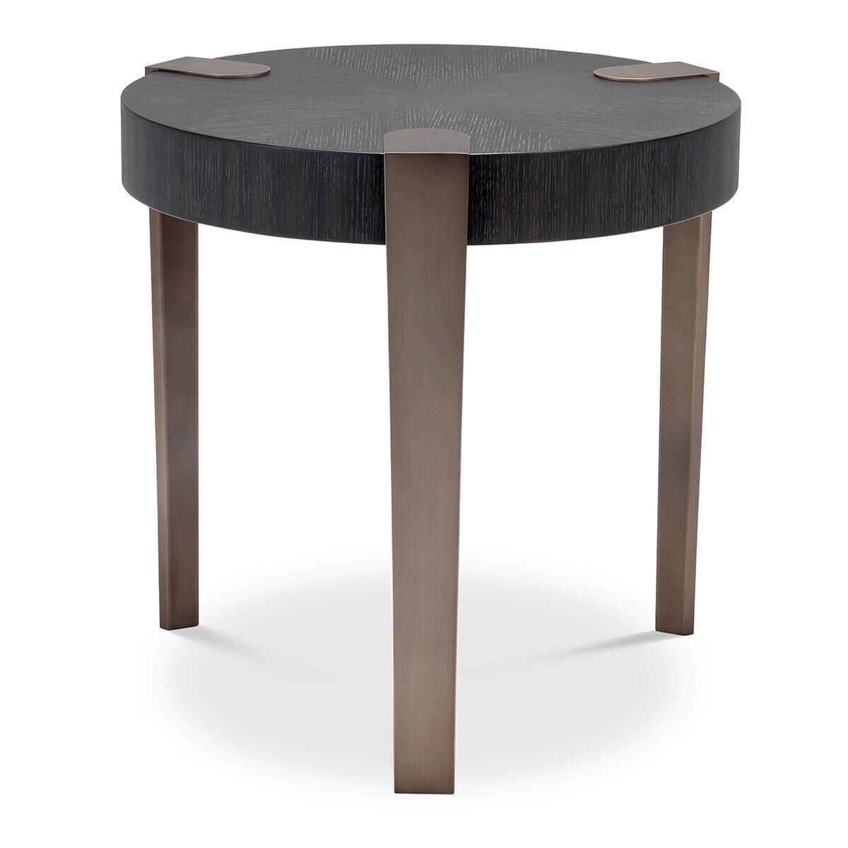 A round coffee table with a dark top and bronze legs.