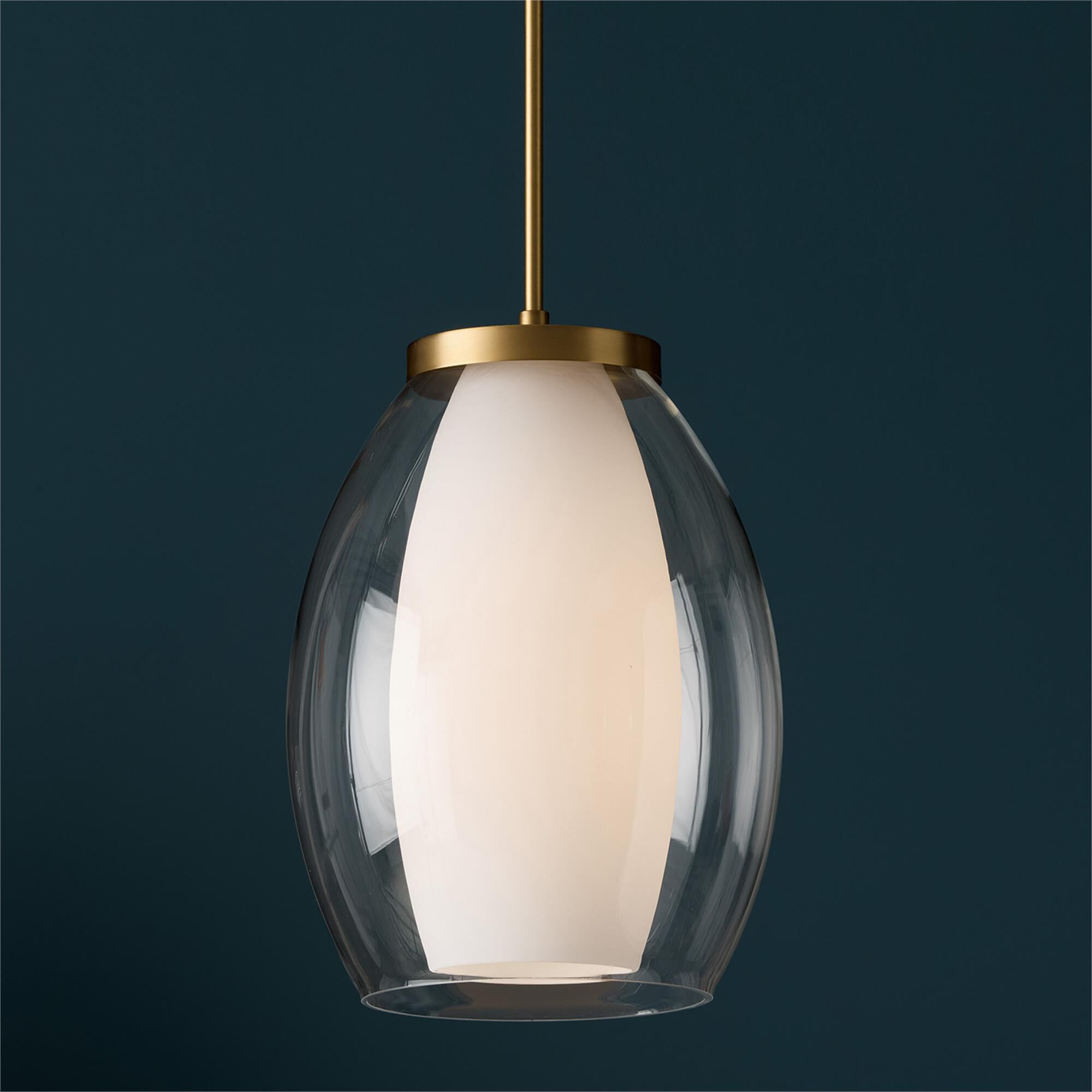 Shown in Aged Brass finish and Layered White And Clear glass