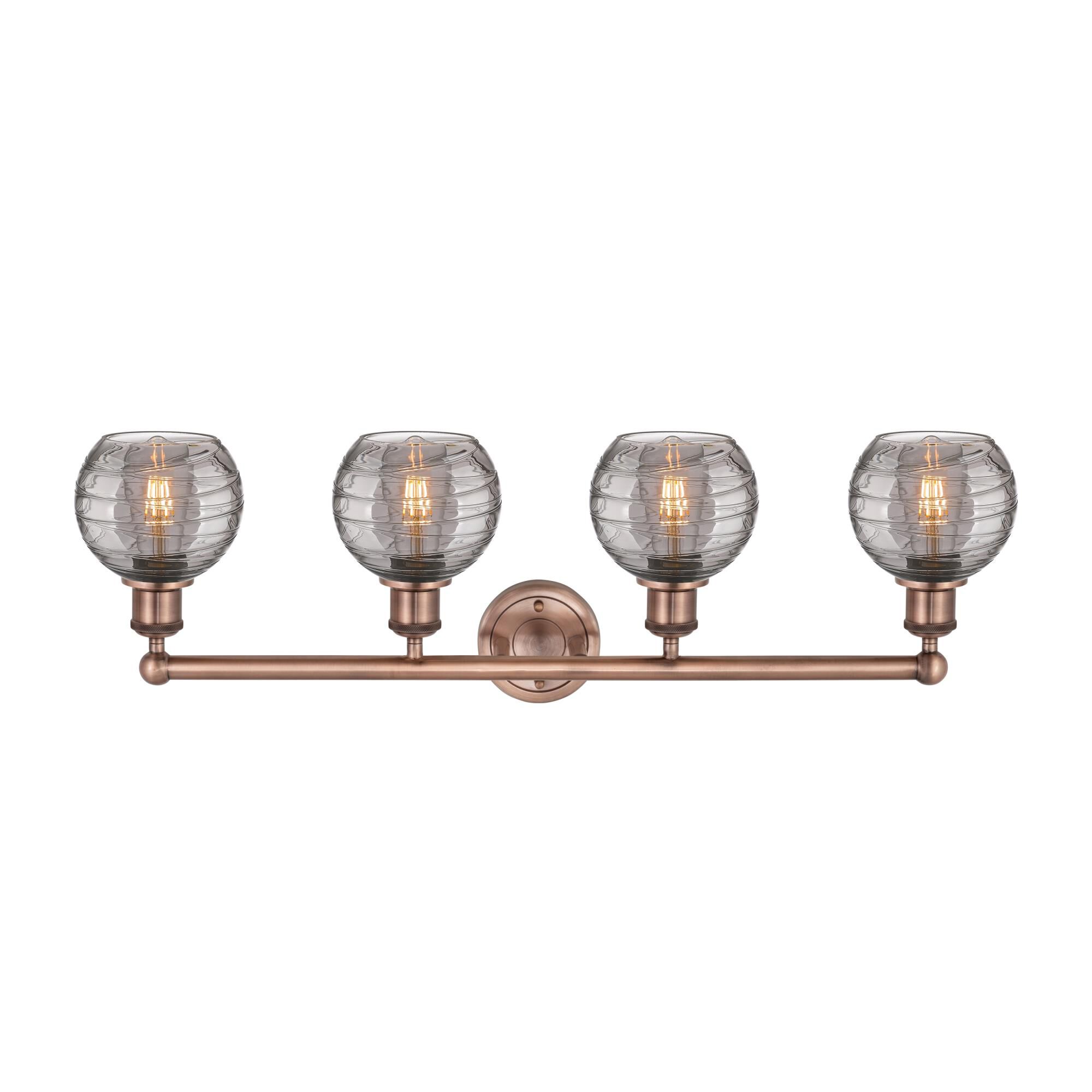 Shown in Antique Copper finish and Light Smoke Deco Swirl glass