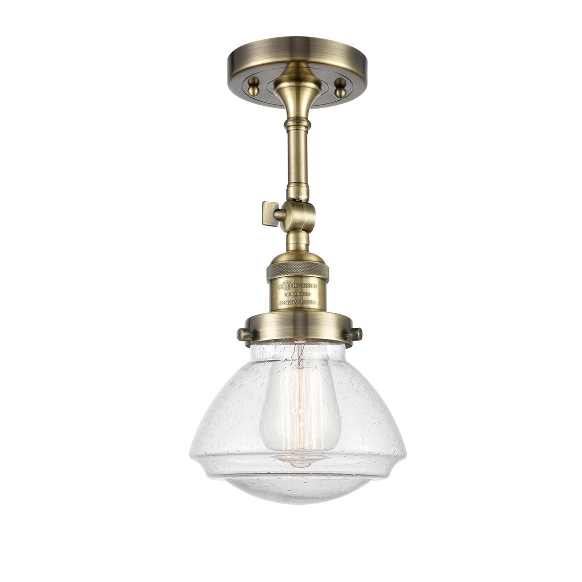 Shown in Antique Brass finish and Bell glass and Glass shade and Bulb Tint - Amber accent
