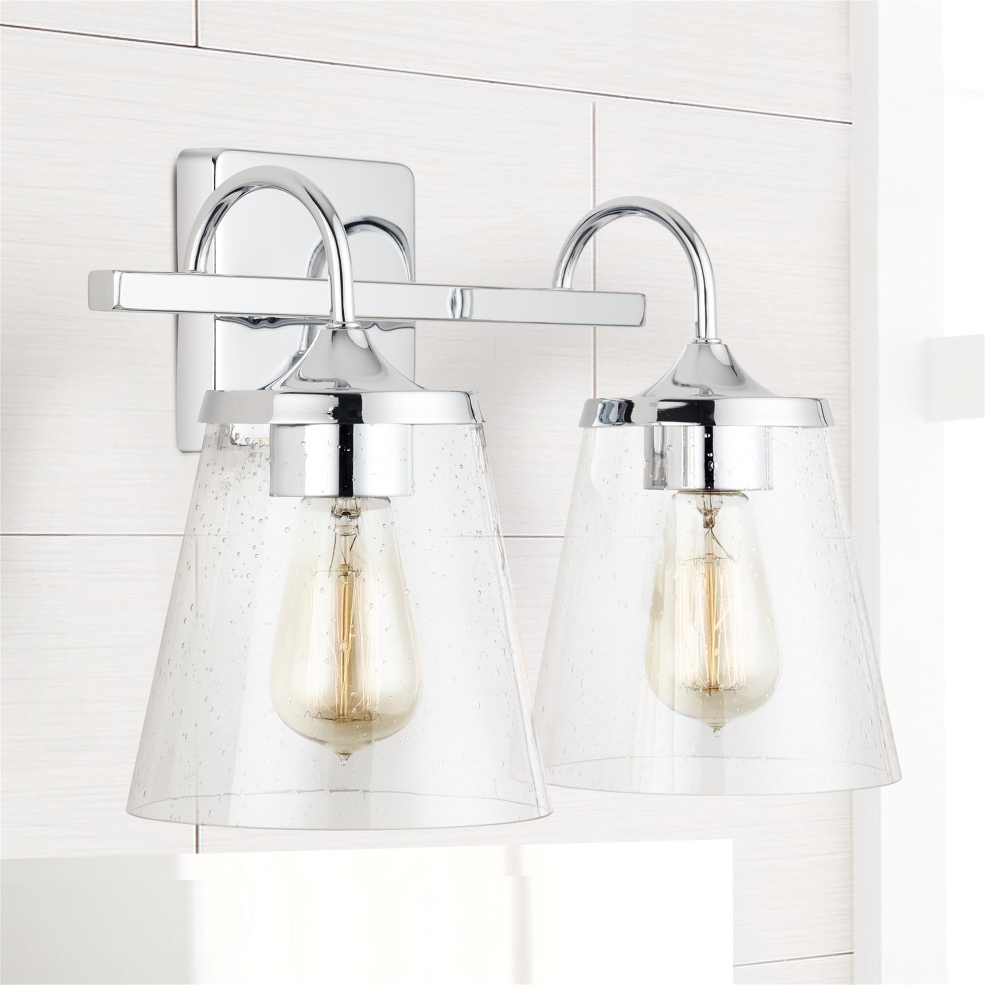 Shown in Chrome finish and Clear Seeded glass