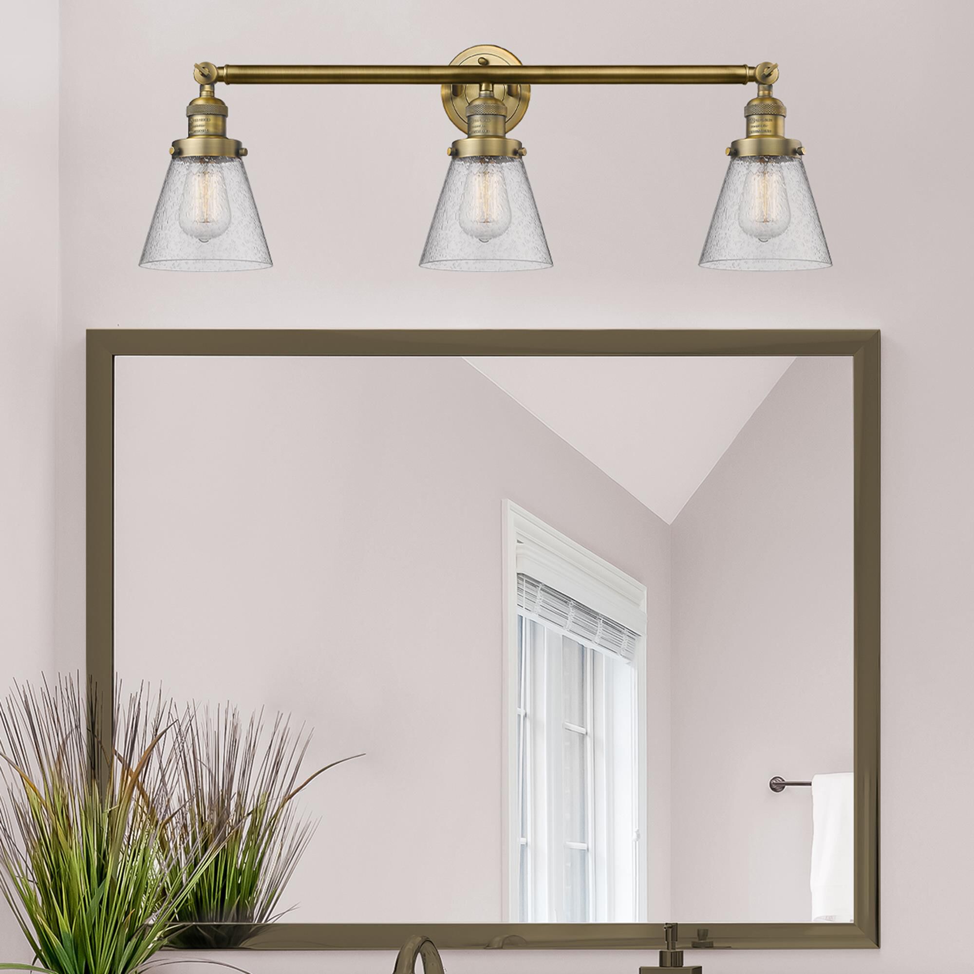 Shown in Brushed Brass finish and Seedy glass