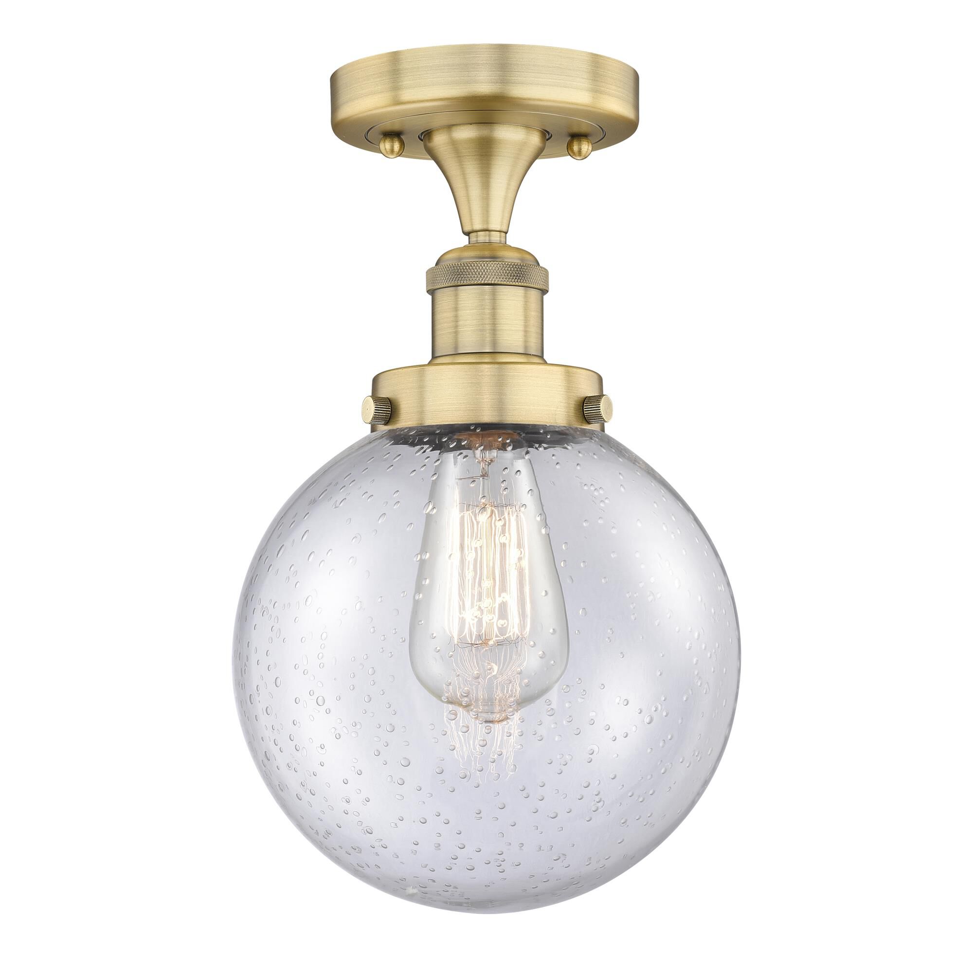 Shown in Brushed Brass finish and Seedy glass