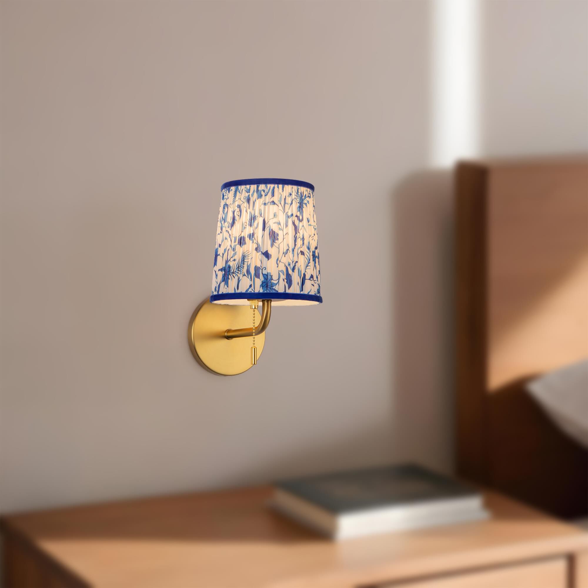 Shown in Brushed Gold finish and Blue Linen shade