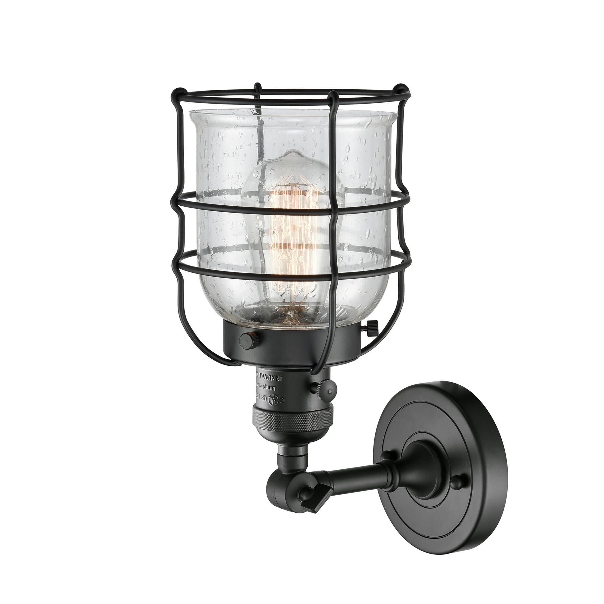 Shown in Matte Black finish and Seedy glass and Switch on Socket accent