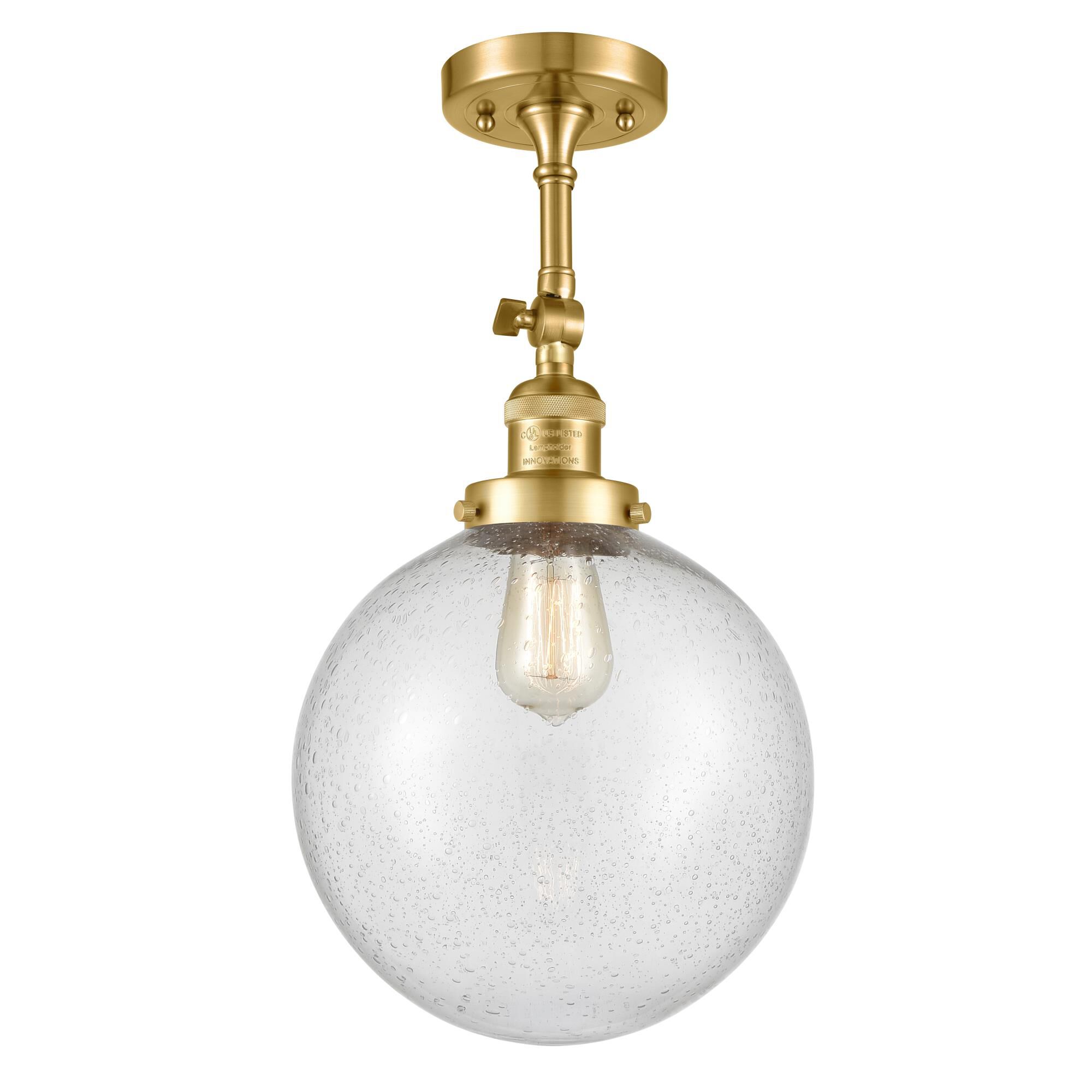 Shown in Satin Gold finish and Seedy Beacon glass