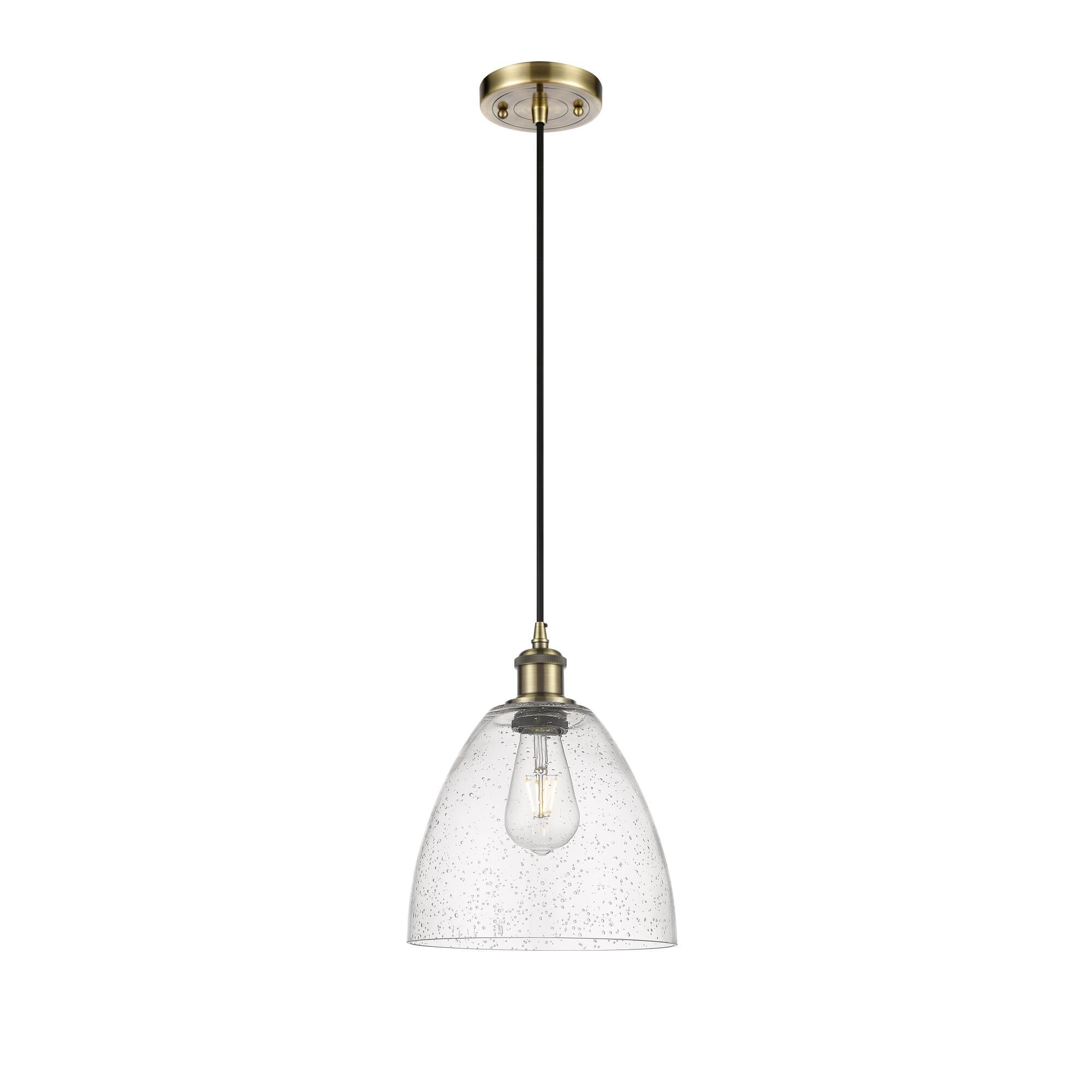 Shown in Antique Brass finish and Seedy glass