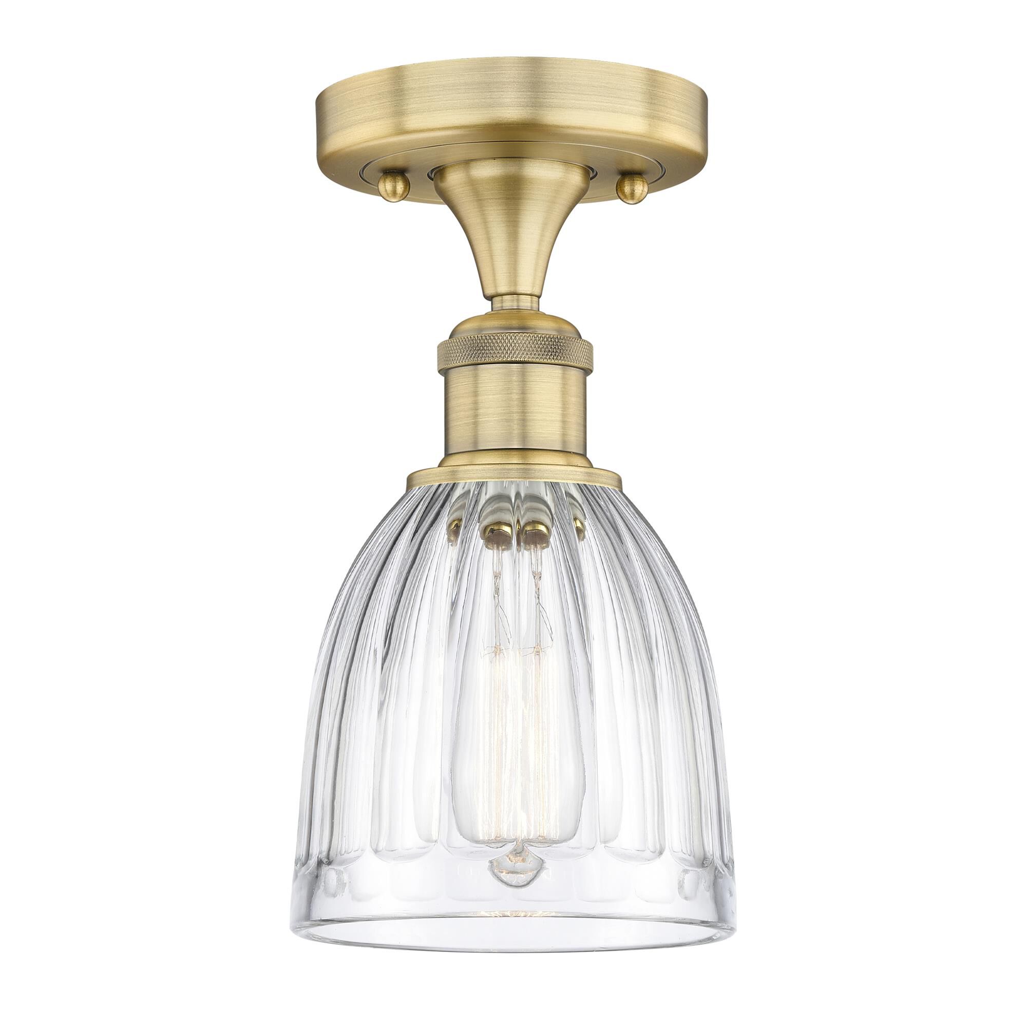 Shown in Brushed Brass finish and Clear glass