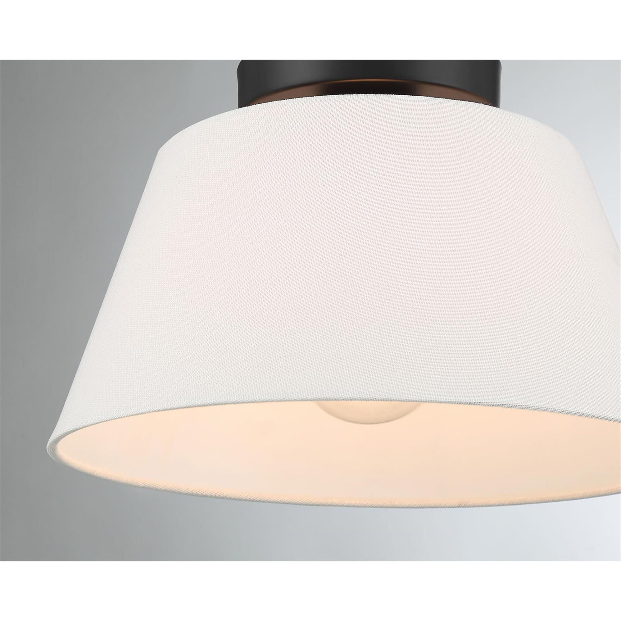 Shown in Matte Black finish and White Linen Fabric shade
