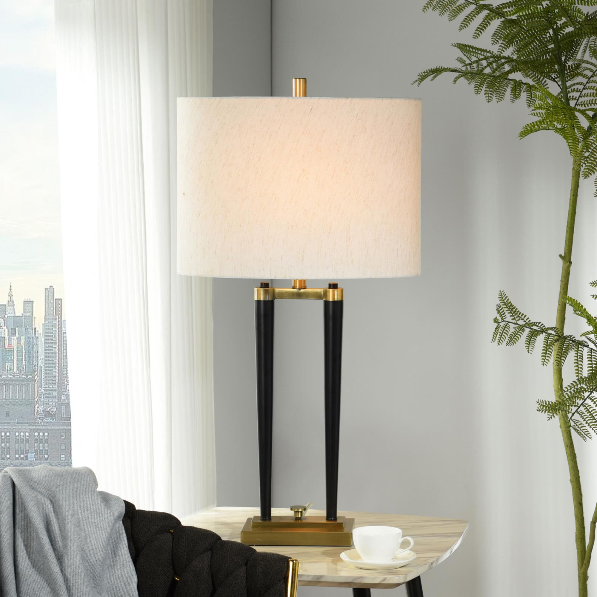 Shown in Brushed Brass finish and Oatmeal Linen shade