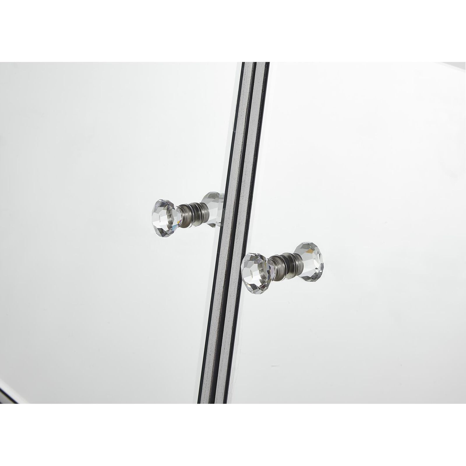 Close-up of crystal knobs on the cabinet hardware.