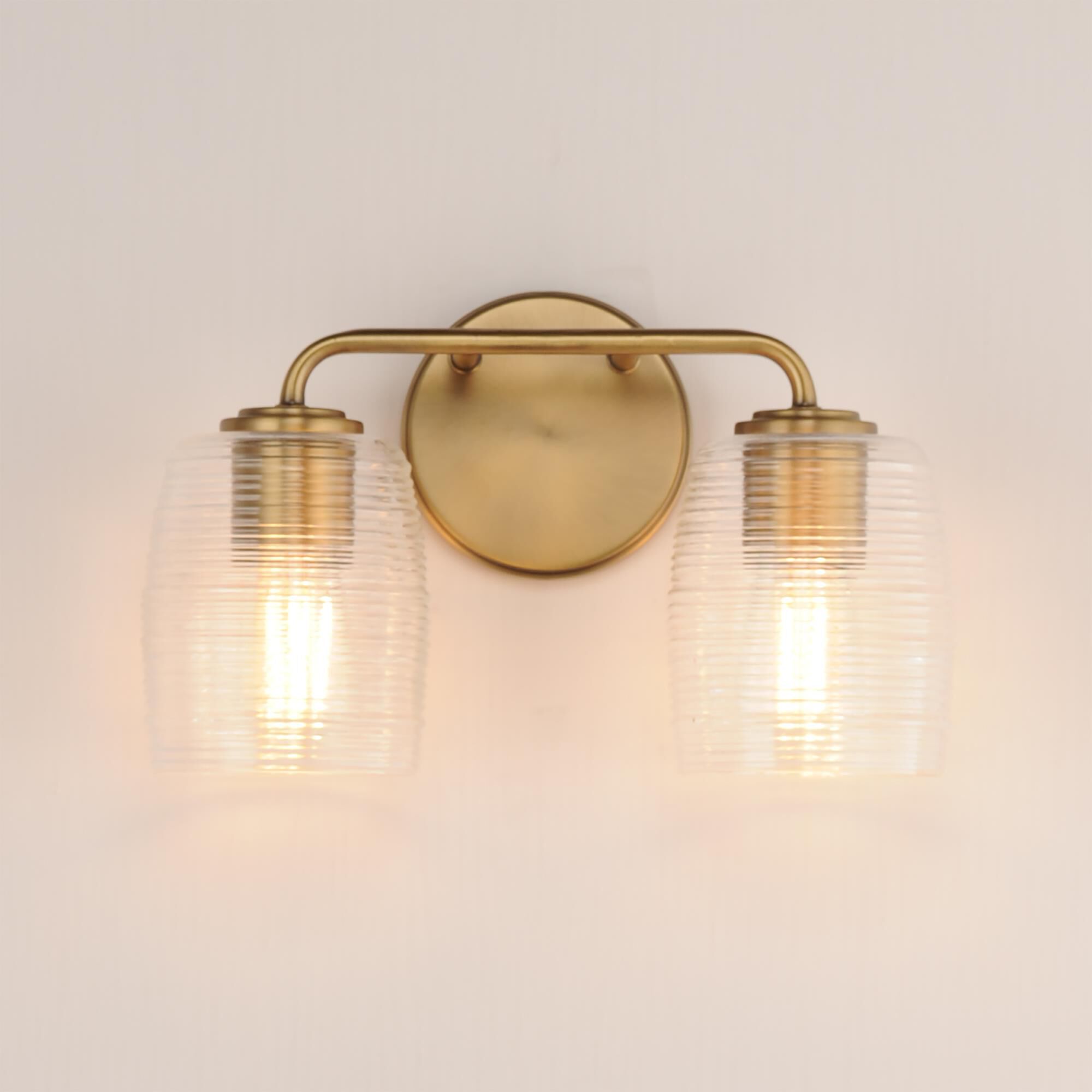 Shown in Natural Aged Brass finish and Clear Ribbed glass