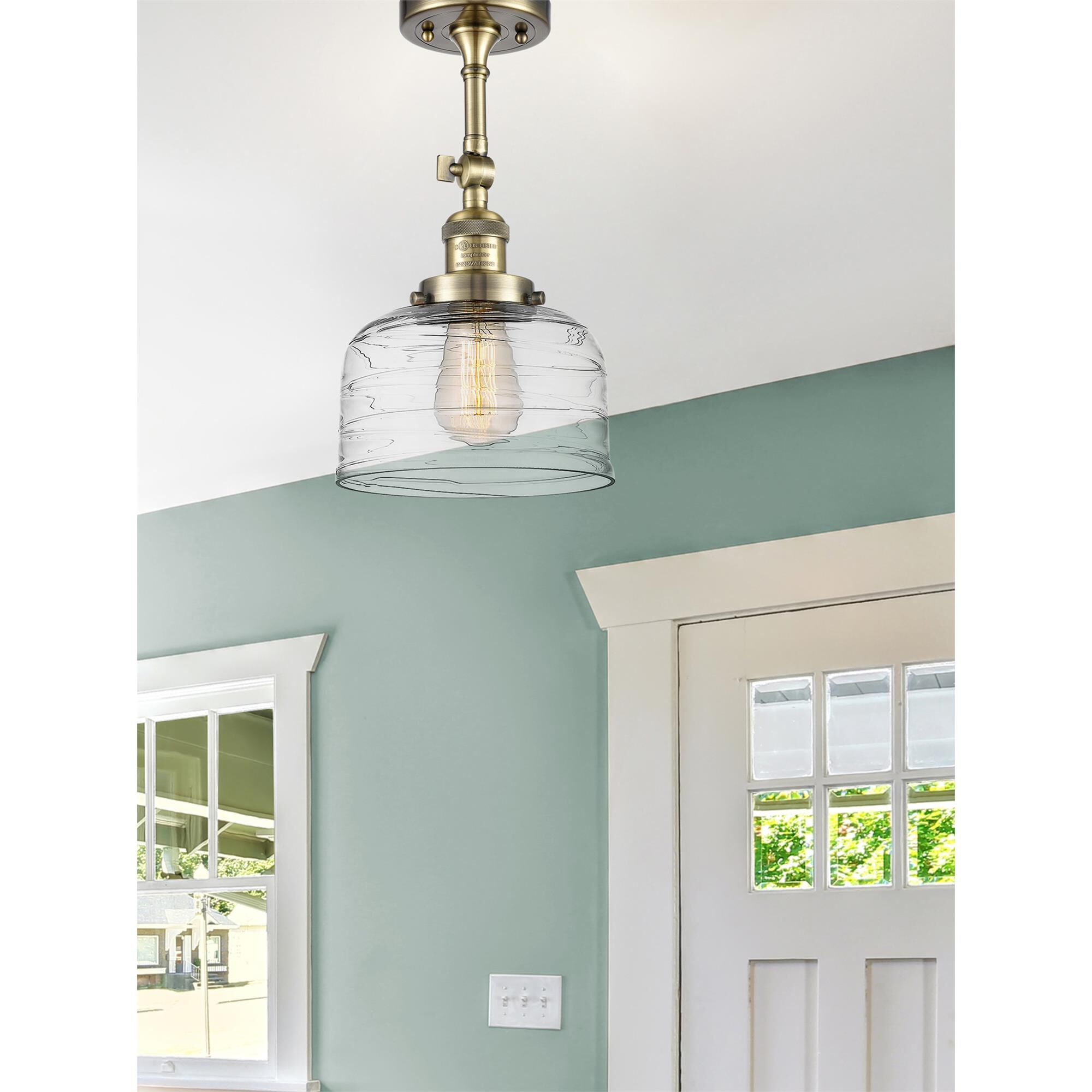 Shown in Antique Brass finish and Clear glass