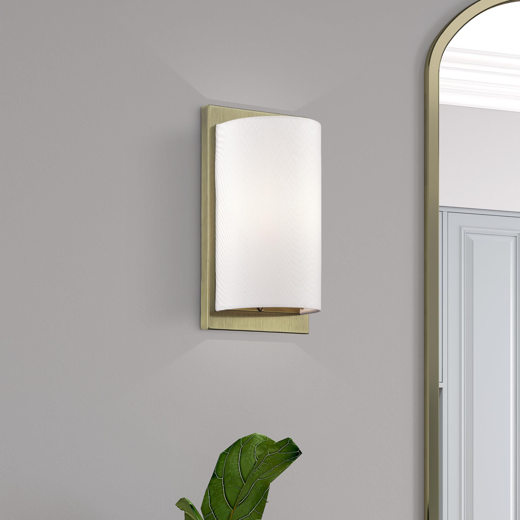 Shown in Antique Brass finish and Hand Crafted Off-White Fabric Hardback shade