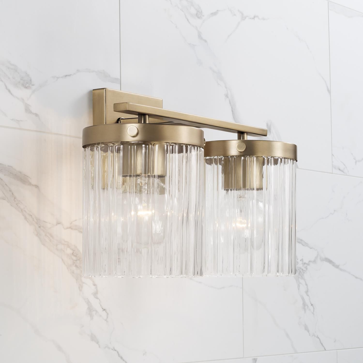 Shown in Aged Brass finish and Beveled Fluted glass