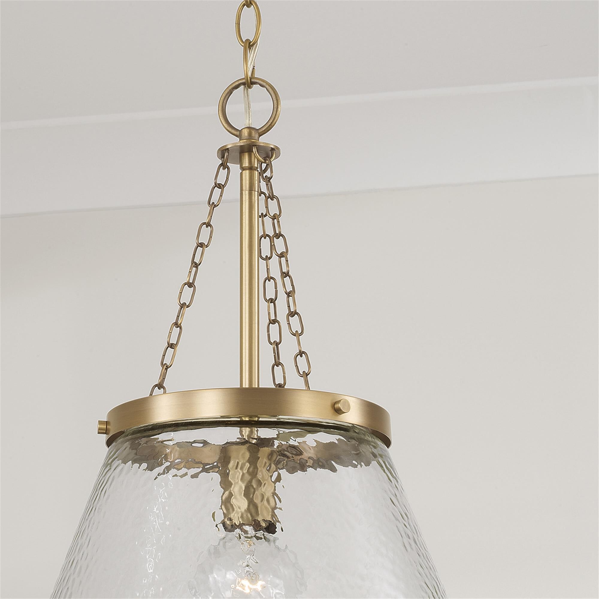 Shown in Aged Brass finish and Organic Hammered glass