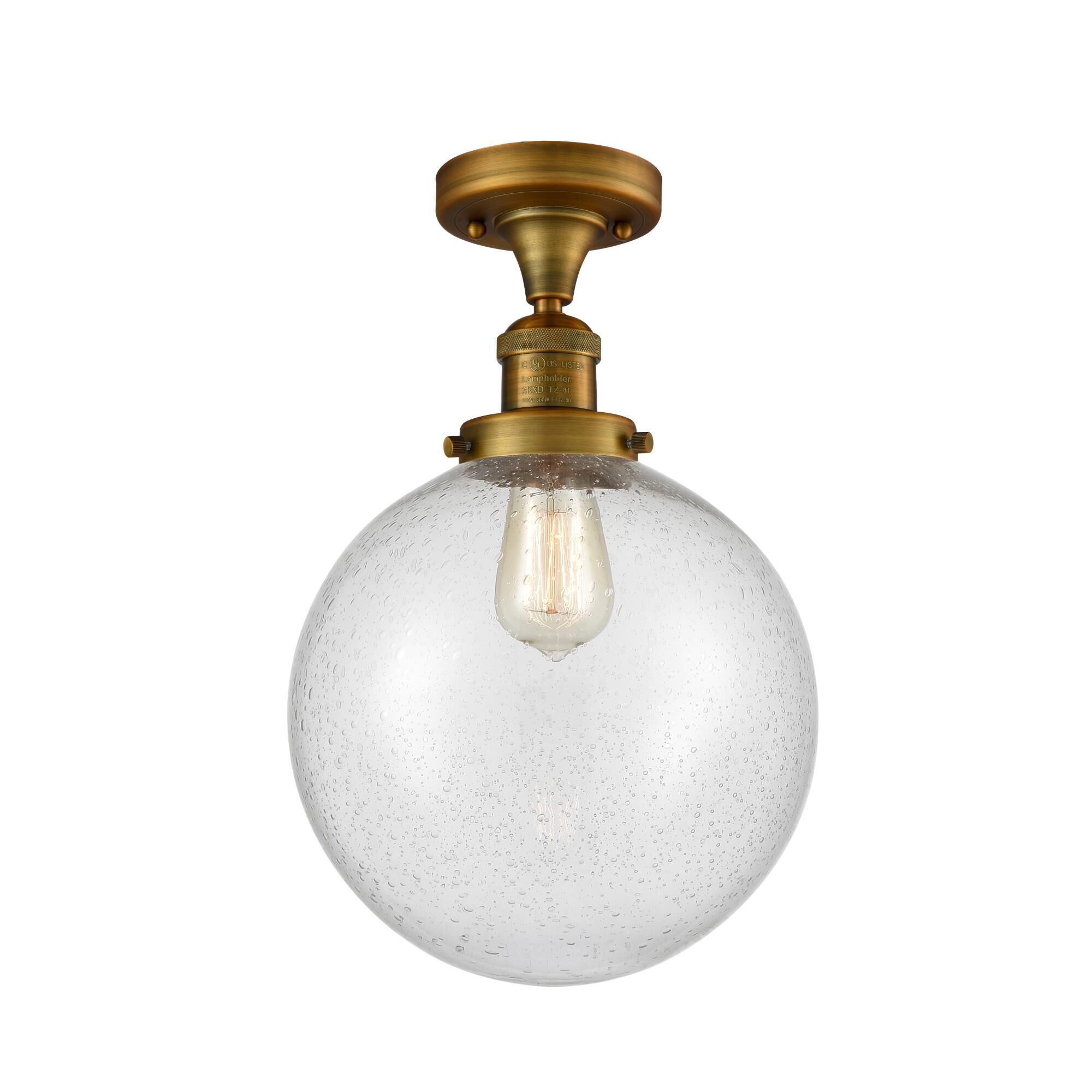 Shown in Brushed Brass finish and Seedy glass