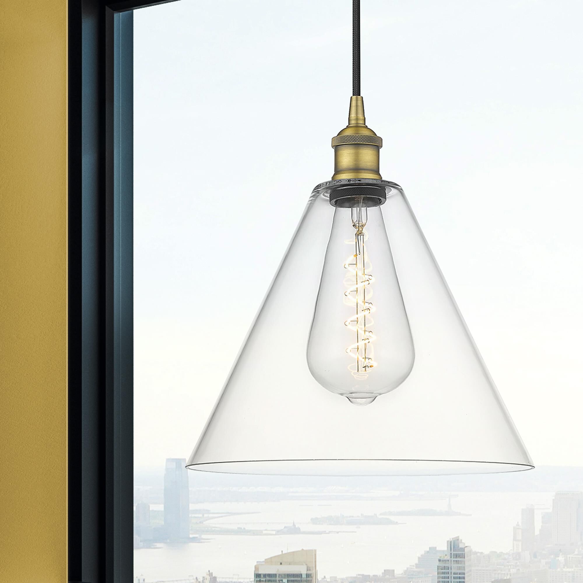 Shown in Brushed Brass finish and Cased Matte White glass