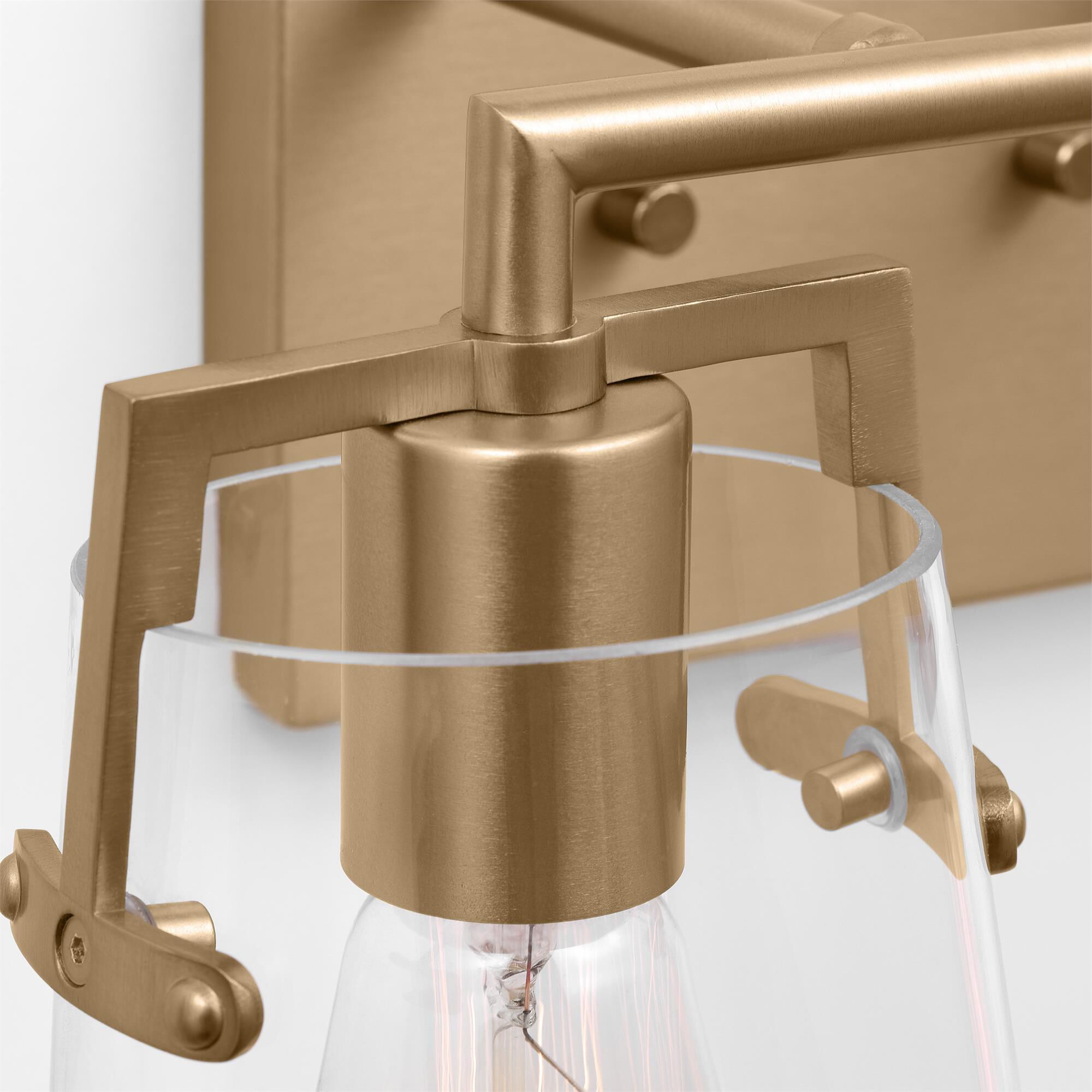 Shown in Satin Brass finish and Clear Glass s shade