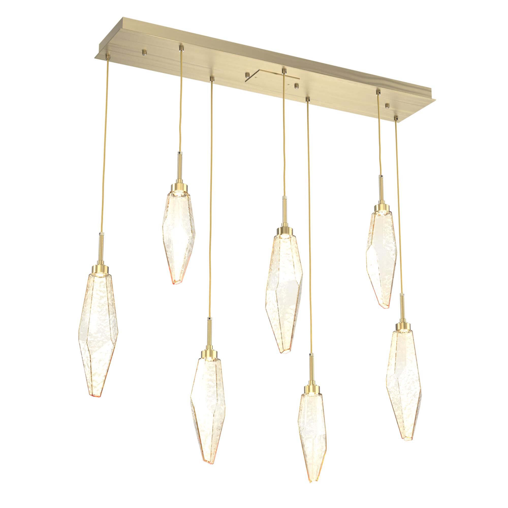 Shown in Novel Brass finish and Chilled Amber glass