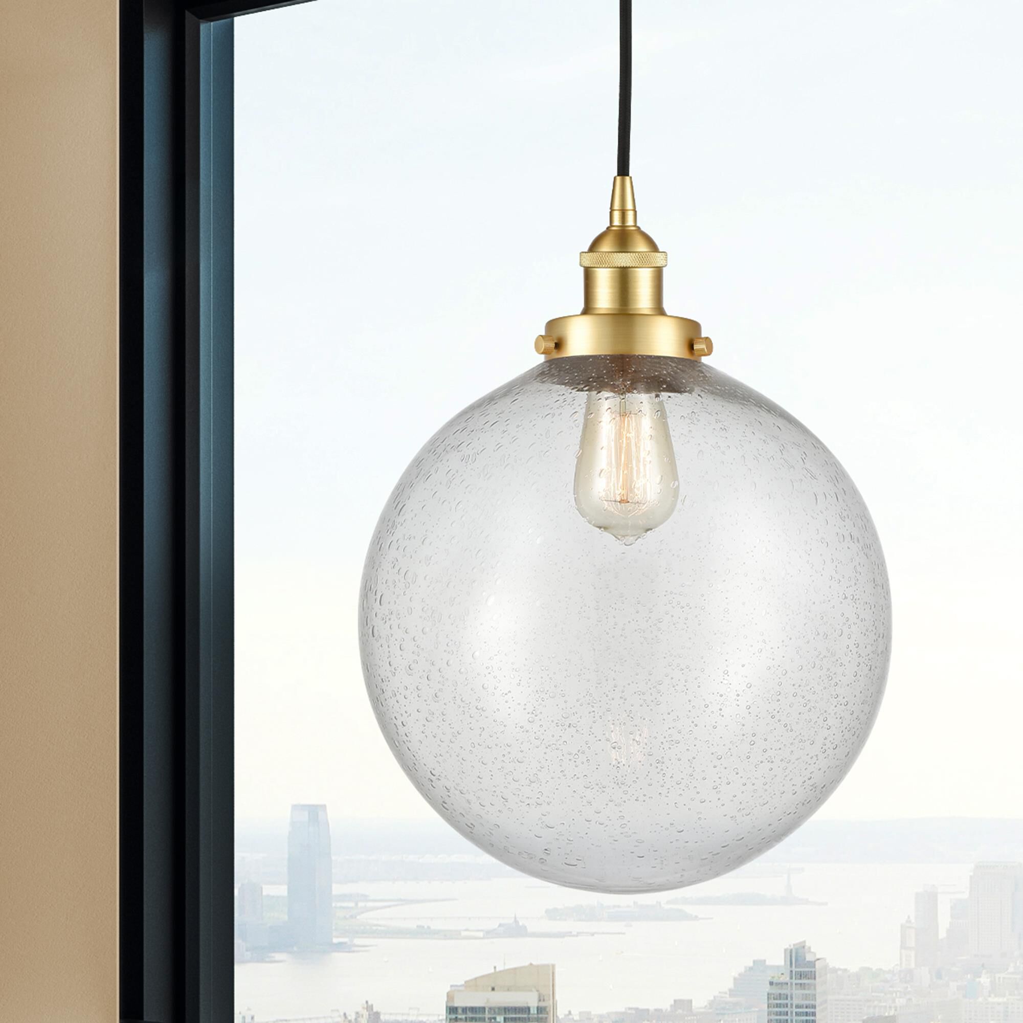 Shown in Satin Gold finish and Seedy Beacon glass
