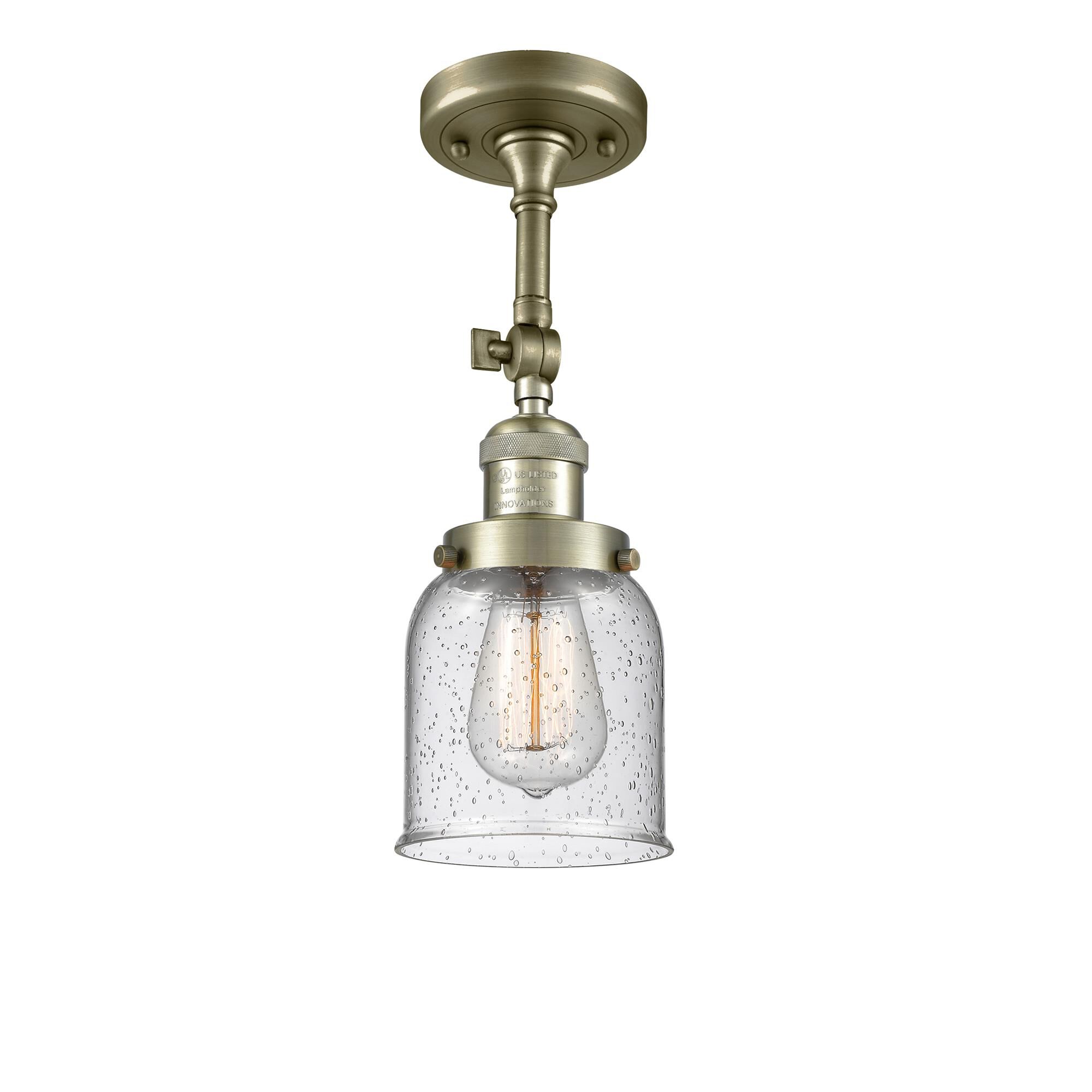 Shown in Antique Brass finish and Seedy glass