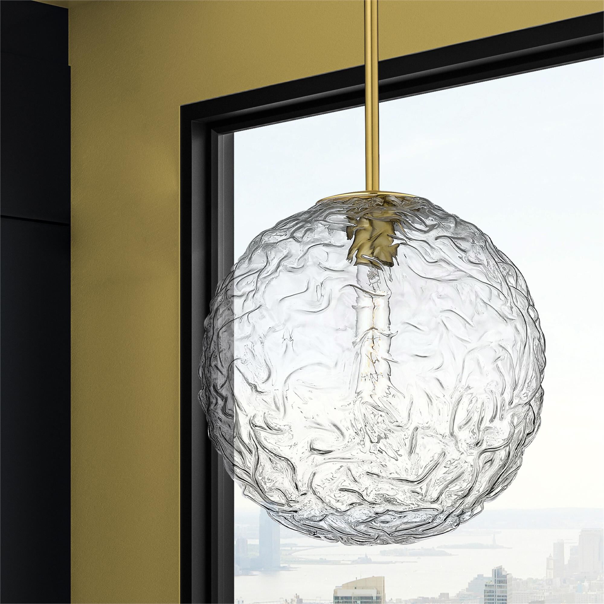 Shown in Brushed Brass finish and Clear shade