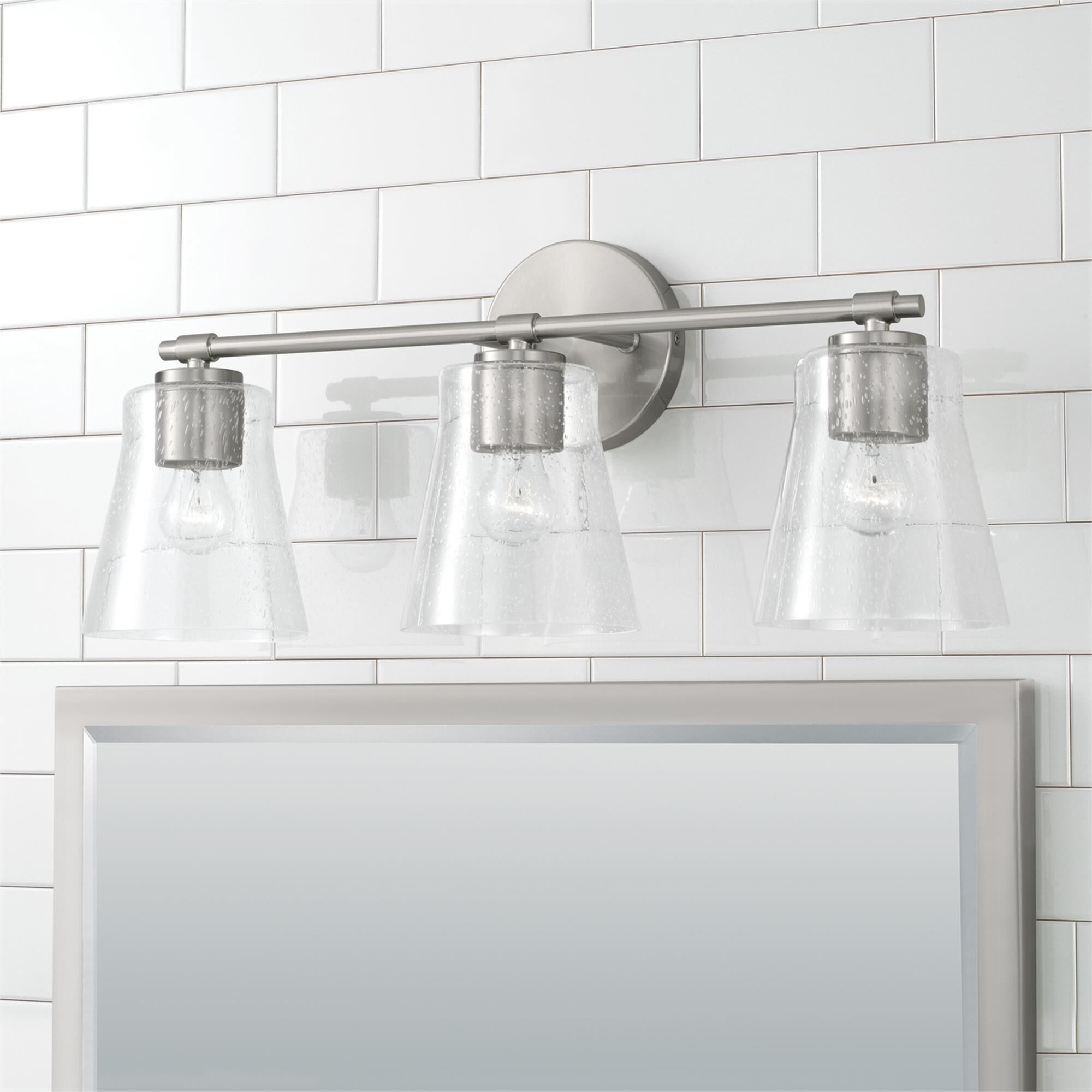 Shown in Brushed Nickel finish and Clear Seeded glass