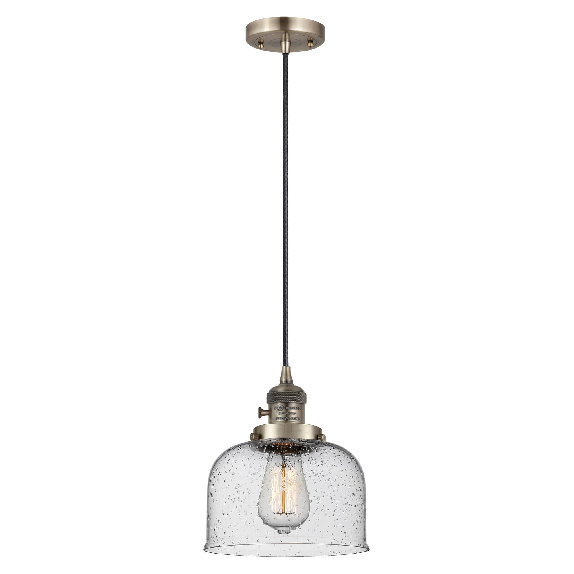Shown in Antique Brass finish and Seedy glass