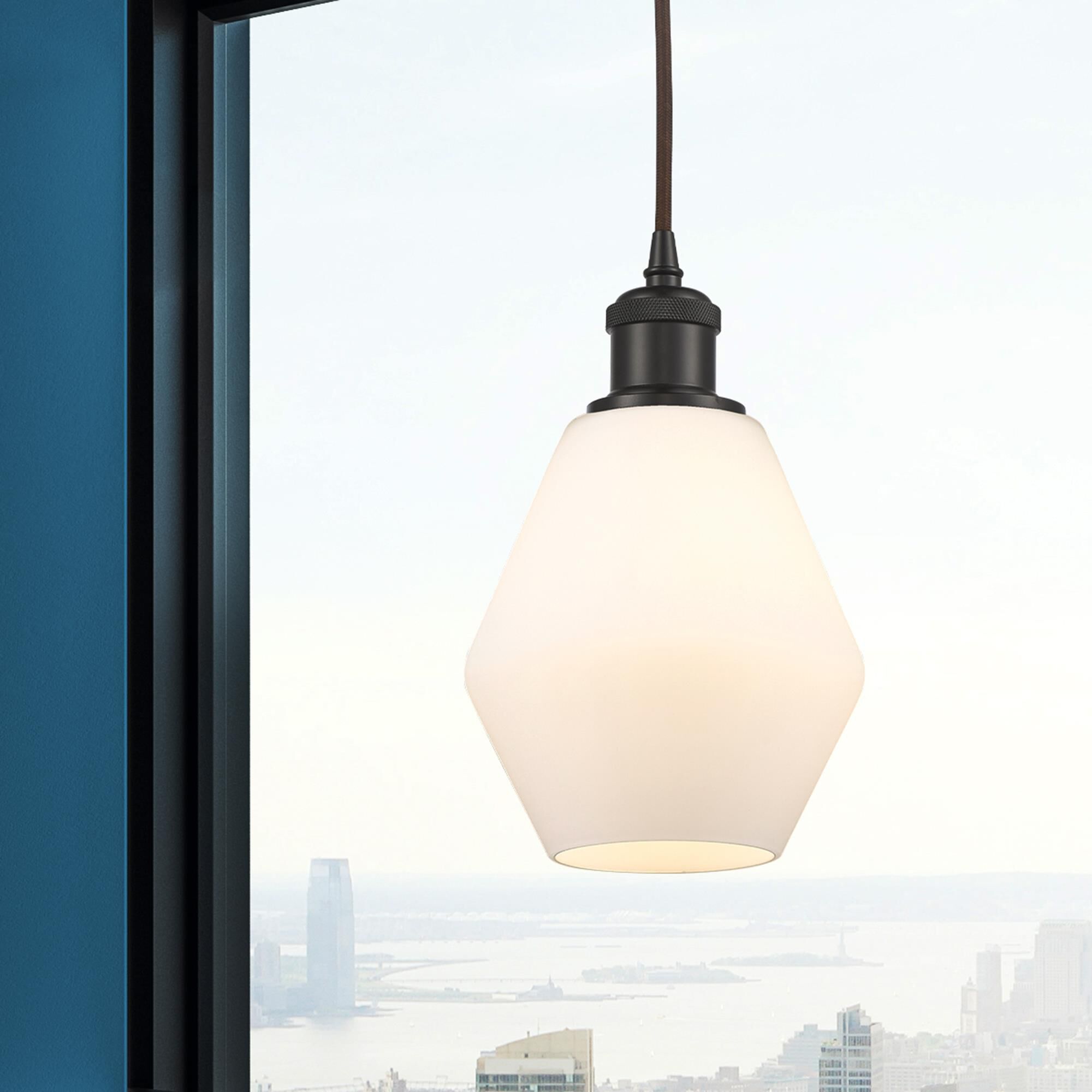 Shown in Oil Rubbed Bronze finish and Matte White glass