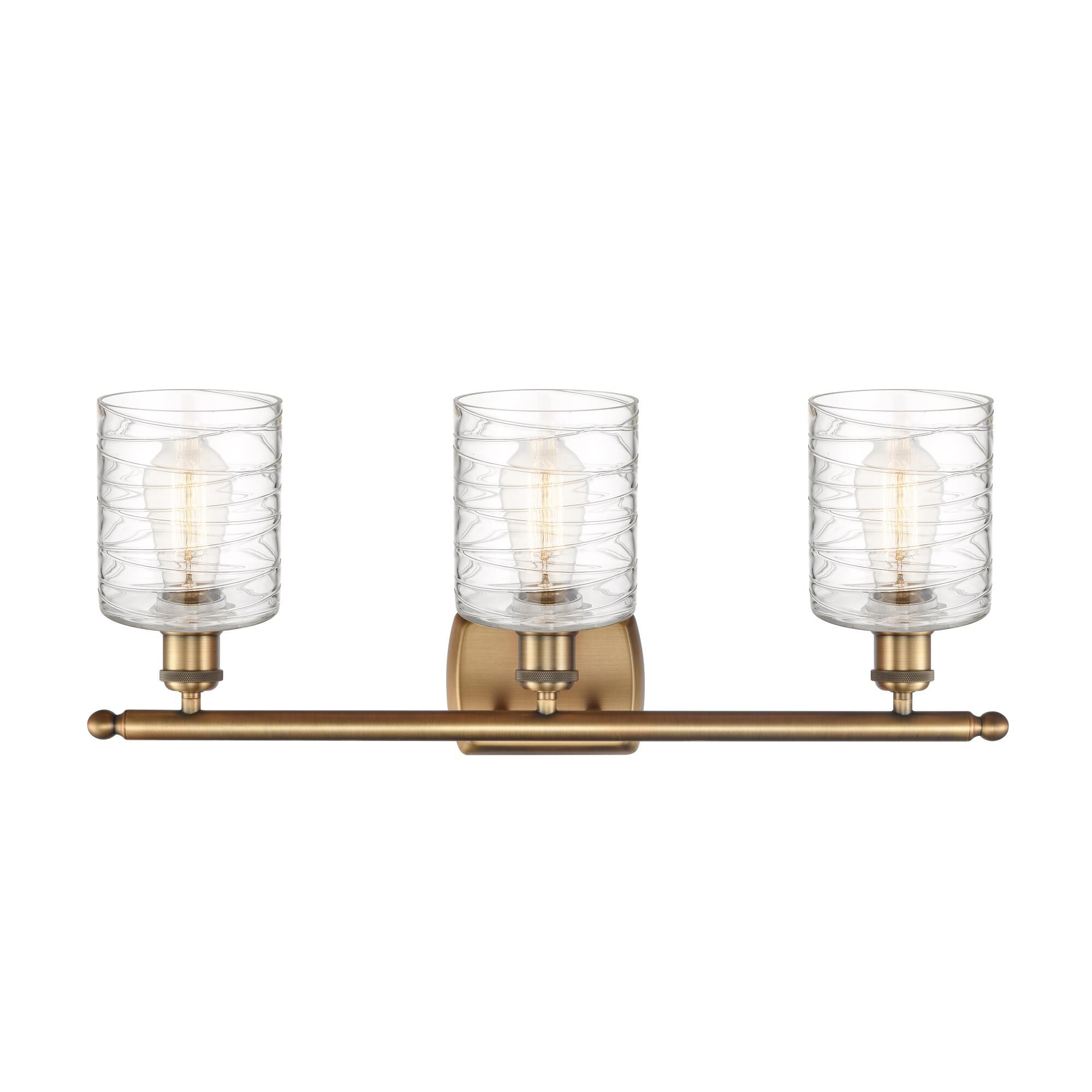 Shown in Brushed Brass finish and Deco Swirl glass