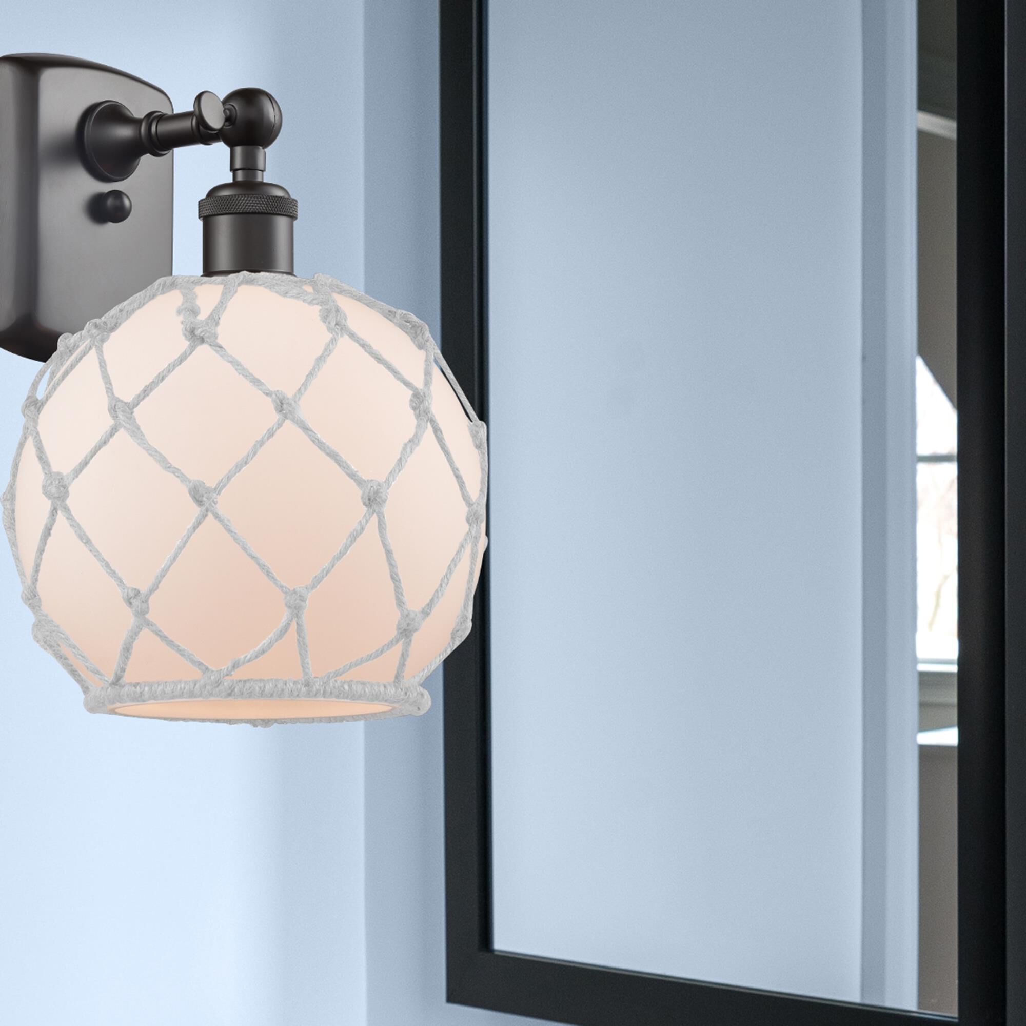 Shown in Oil Rubbed Bronze finish and White With White Rope glass