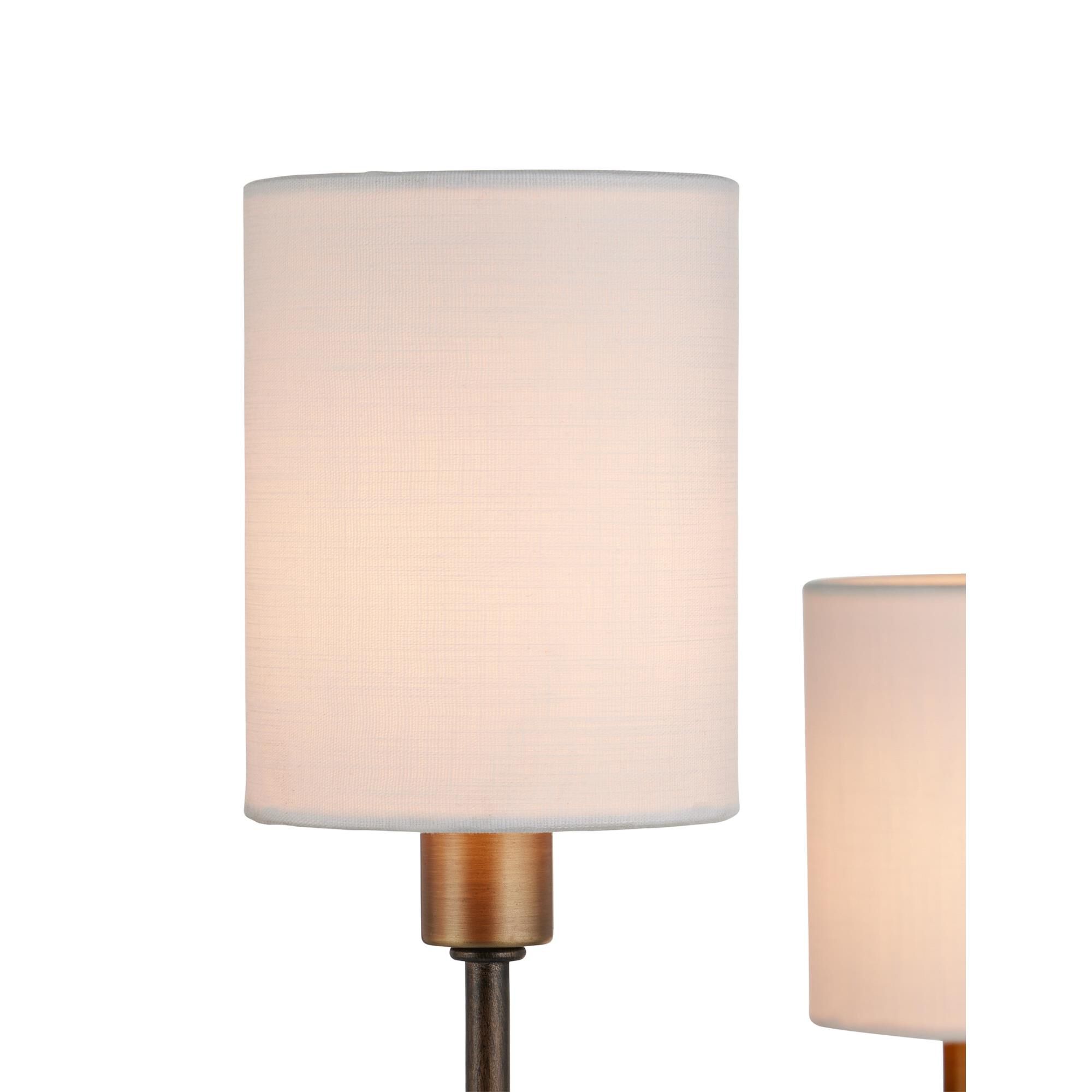 Shown in Statuary Bronze and Antique Brass finish and Off White Linen shade