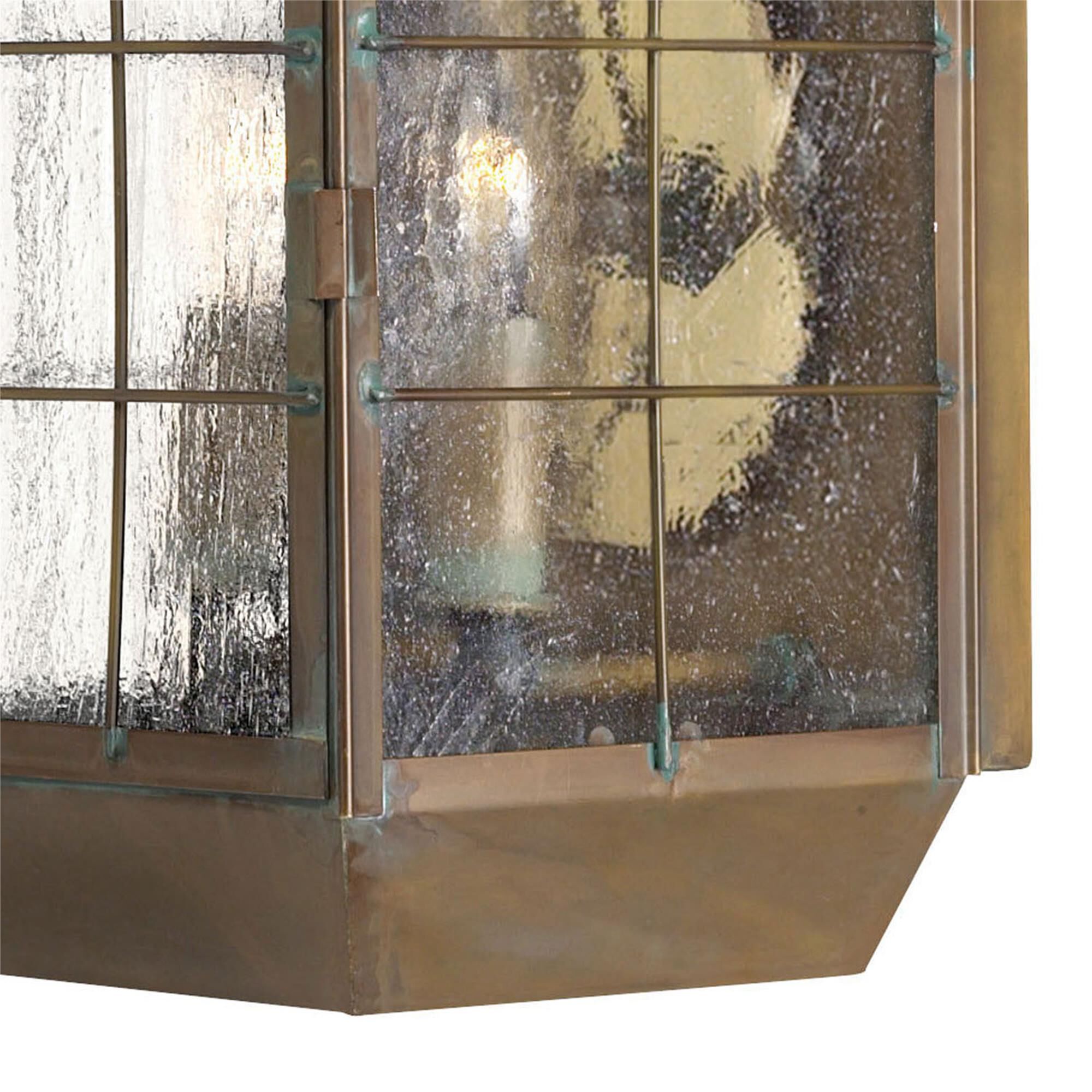 Shown in Aged Brass finish and Clear Seedy Panels glass