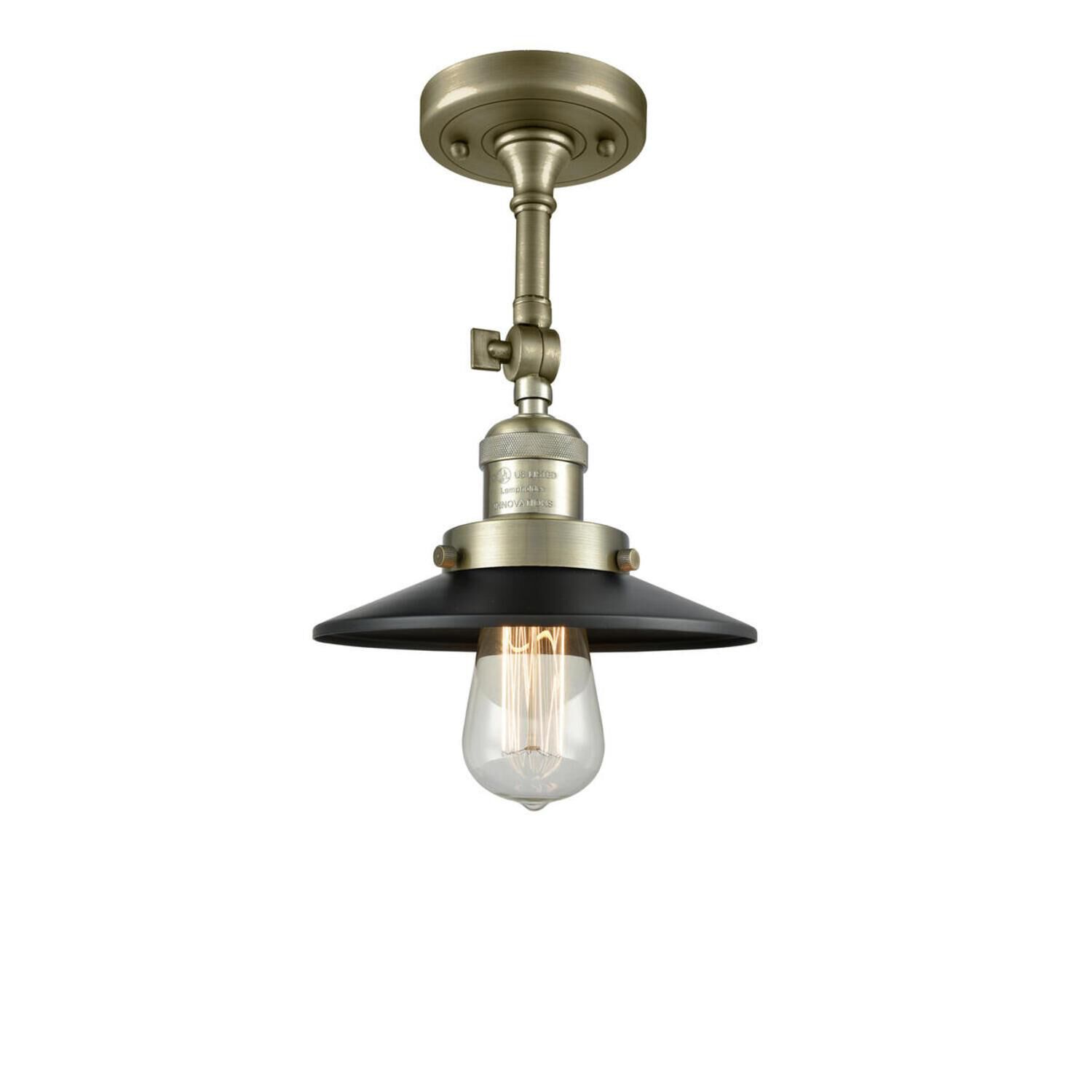 Shown in Antique Brass finish and Antique Brass glass and Matte Black shade and No Accent accent
