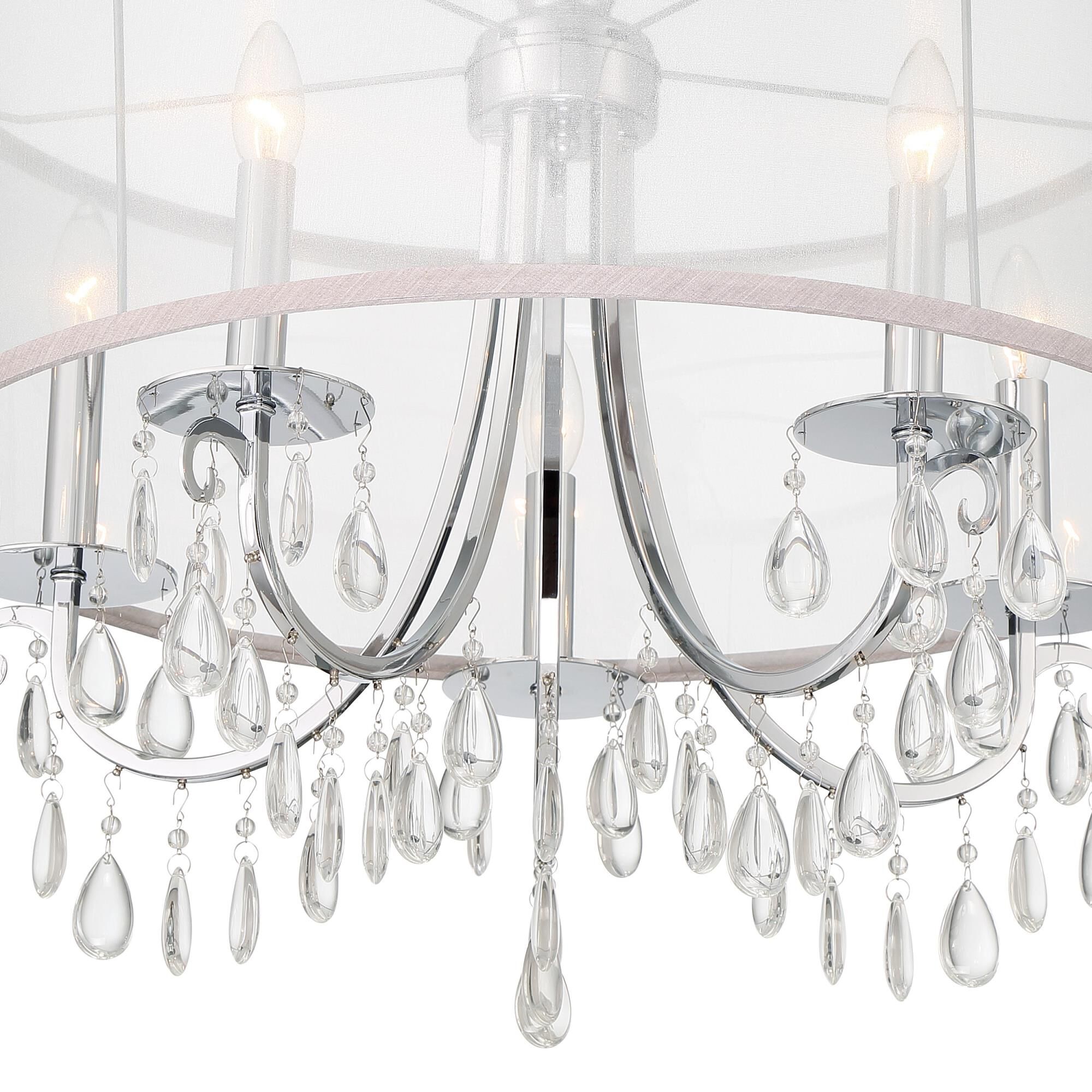 Shown in Polished Chrome finish and Clear Teardrop Almond crystal and Silk glass and Translucent Silver shade