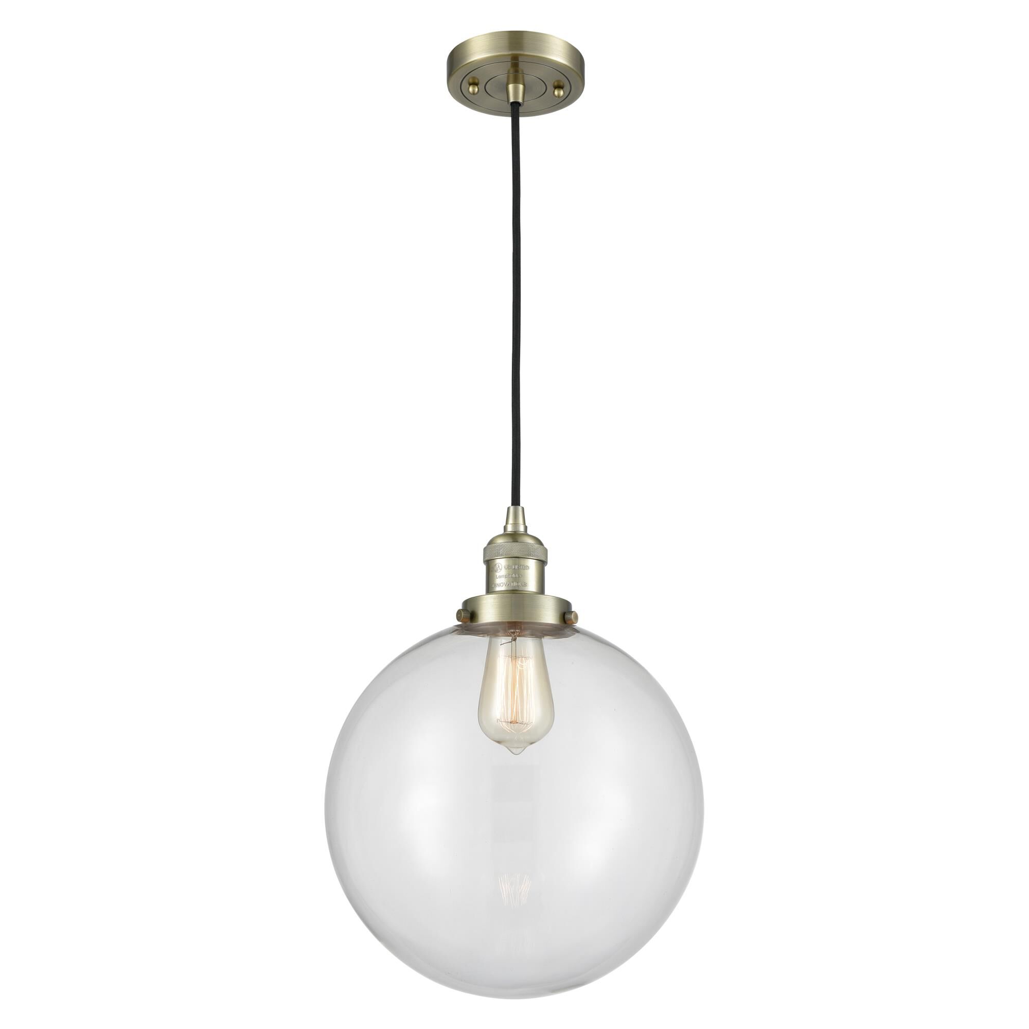 Shown in Antique Brass finish and Clear Beacon glass