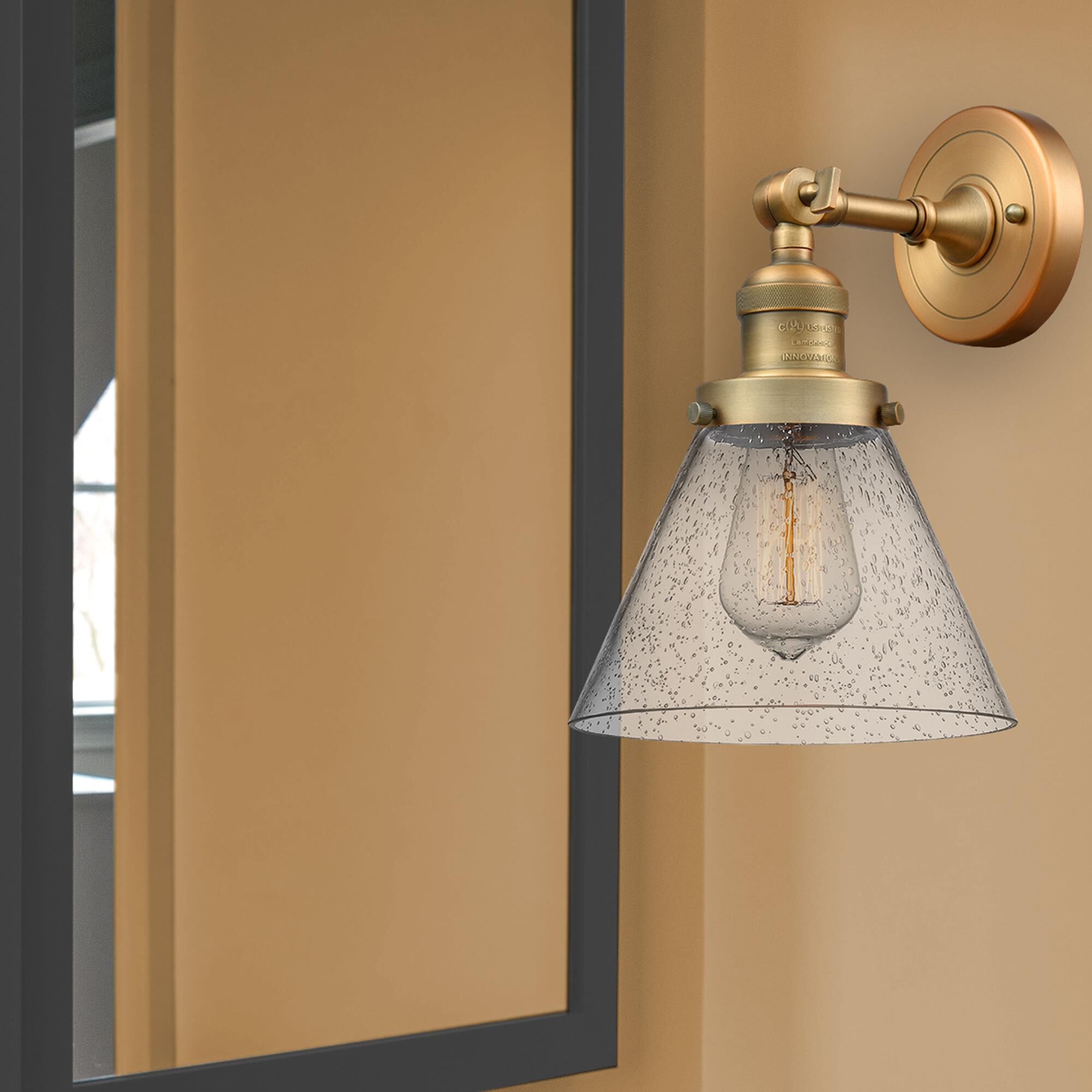 Shown in Brushed Brass finish and Seedy glass