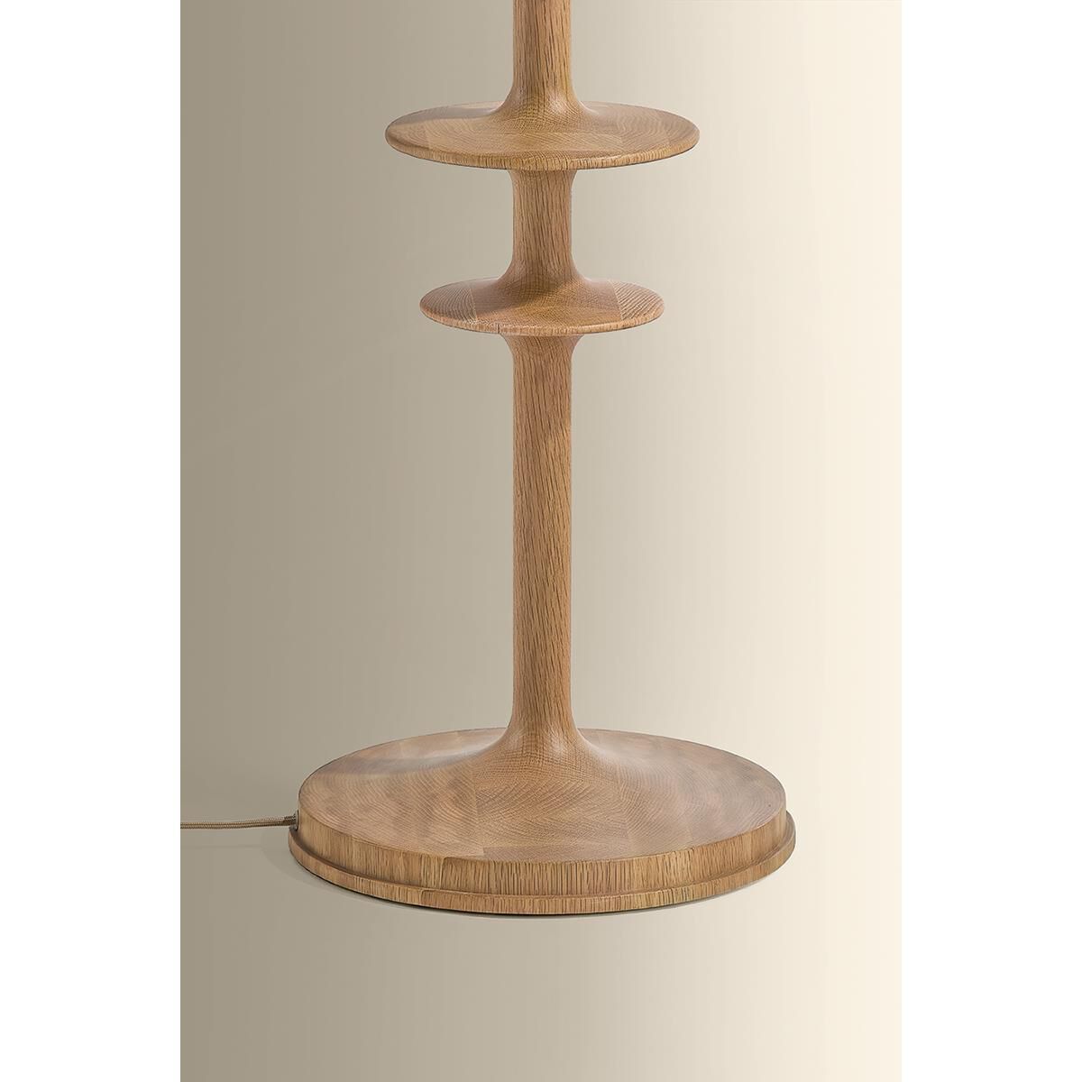 Shown in Aged Brass finish and Wheat Linen shade