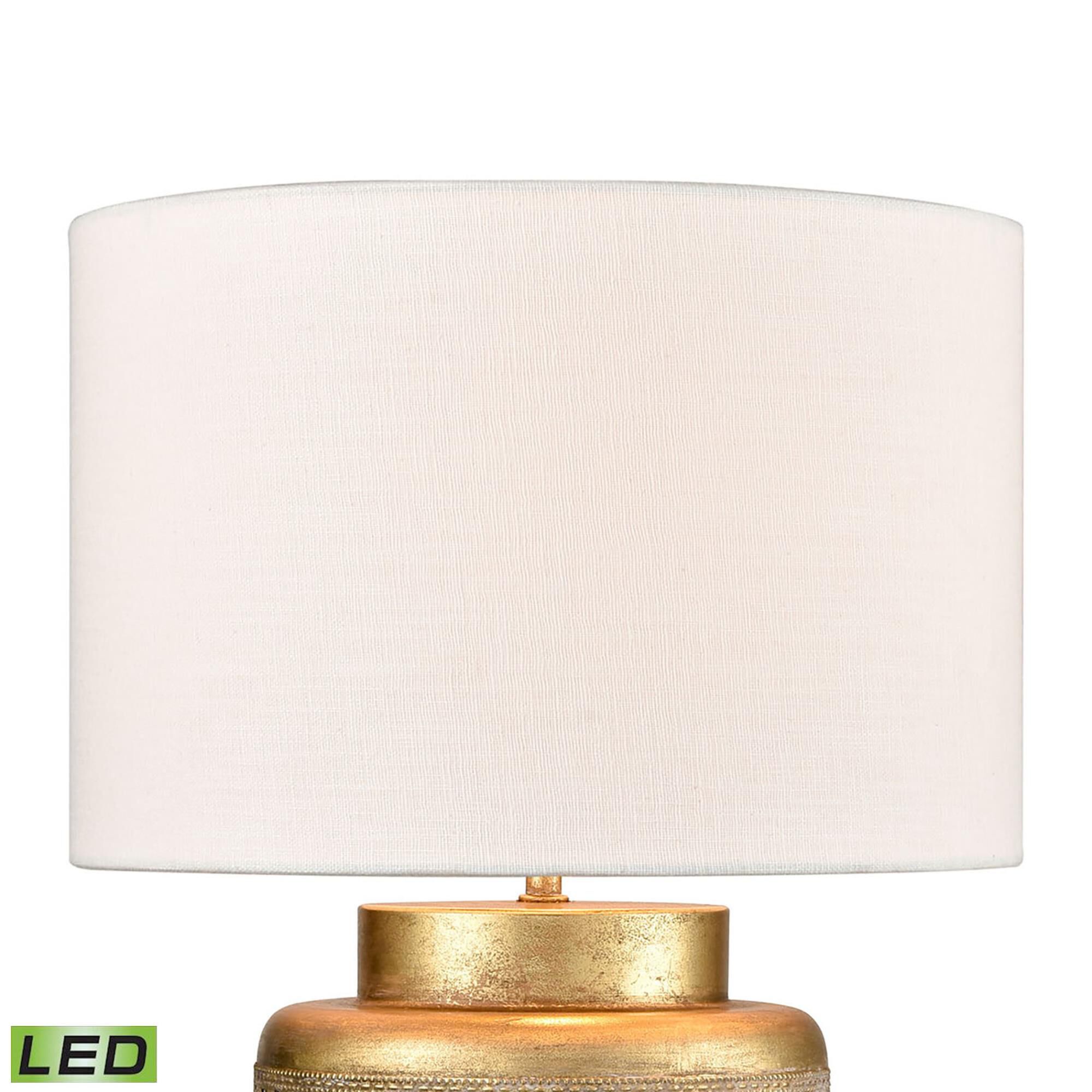 Shown in Antique Gold finish and Off White Textured Linen Drum shade