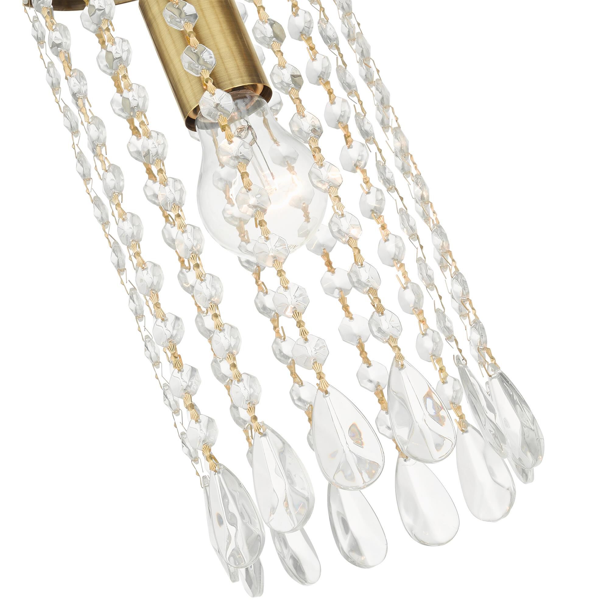 Shown in Antique Brass finish and Hand Assembled Crystal Shade glass