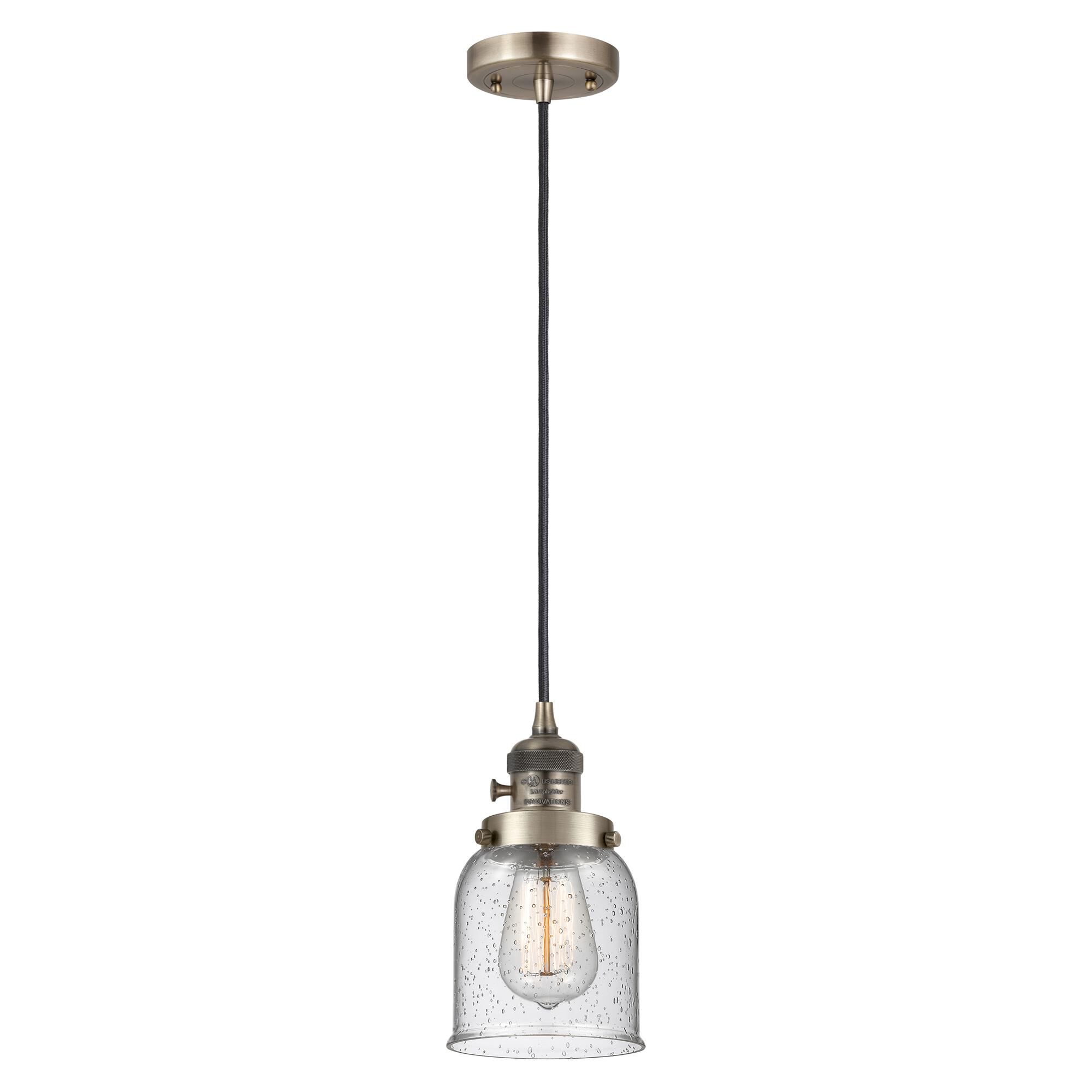 Shown in Antique Brass finish and Seedy glass