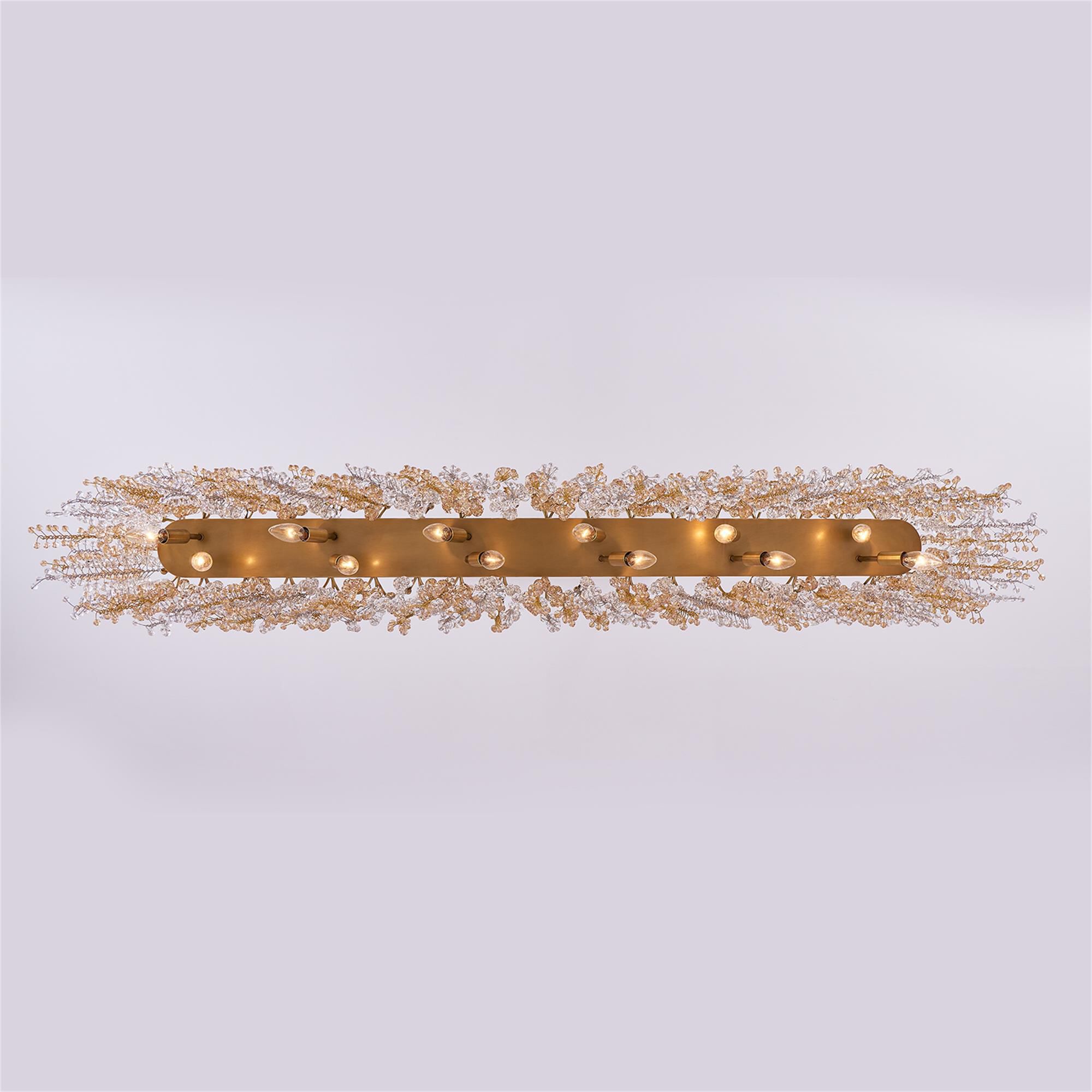 Shown in True Brass finish and Champagne Gold And Clear Firenze crystal