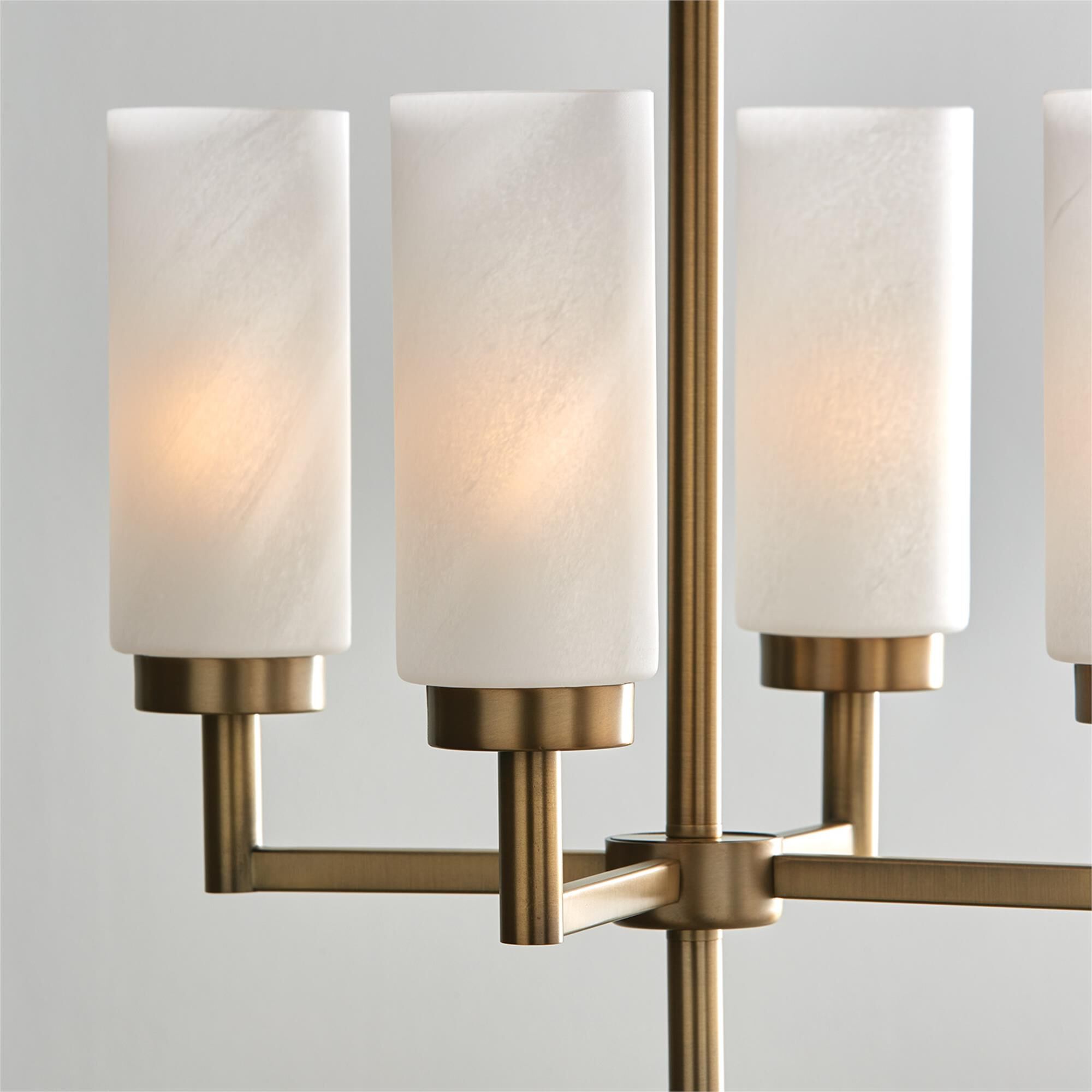 Shown in Aged Brass finish and Faux Alabaster glass