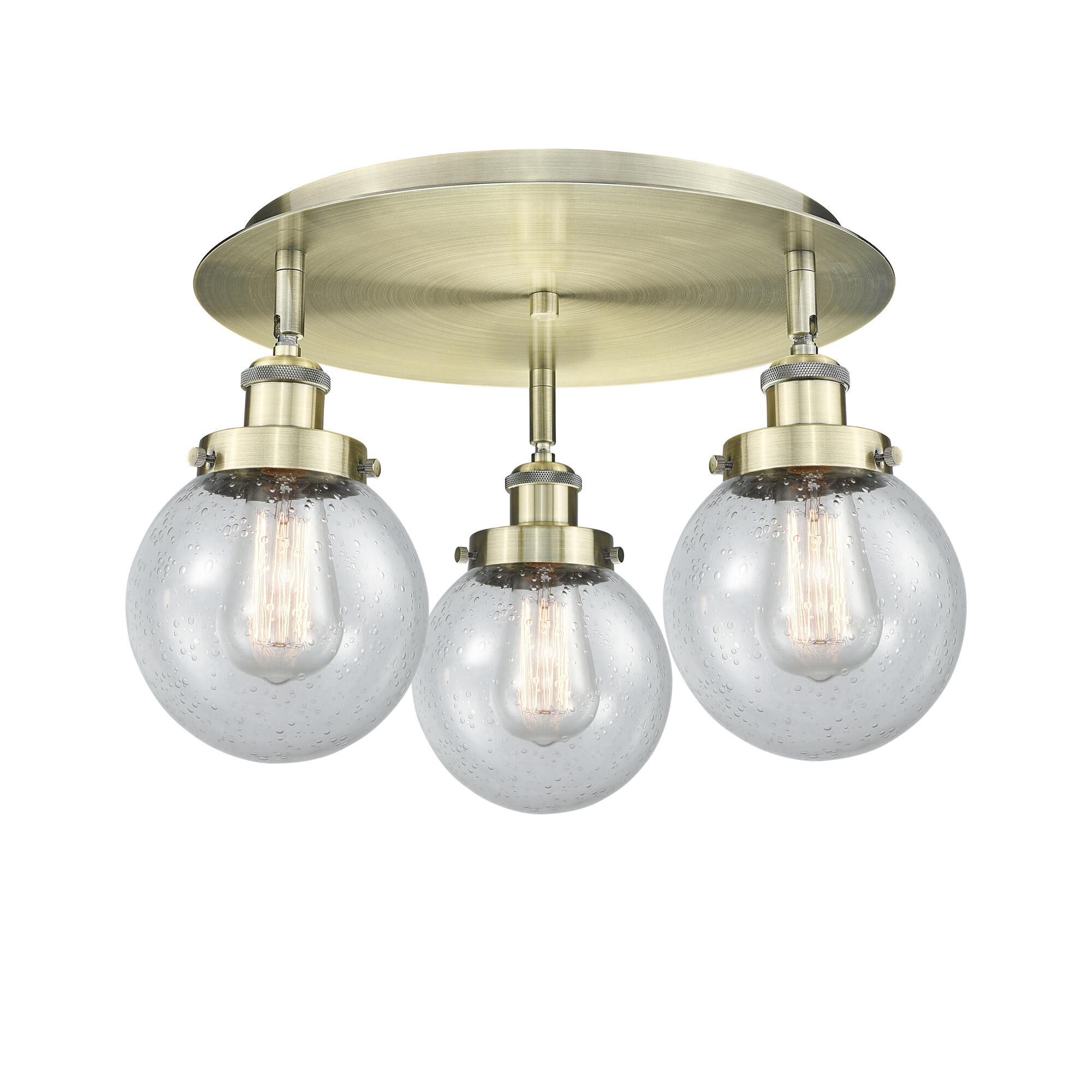 Shown in Antique Brass finish and Seedy glass
