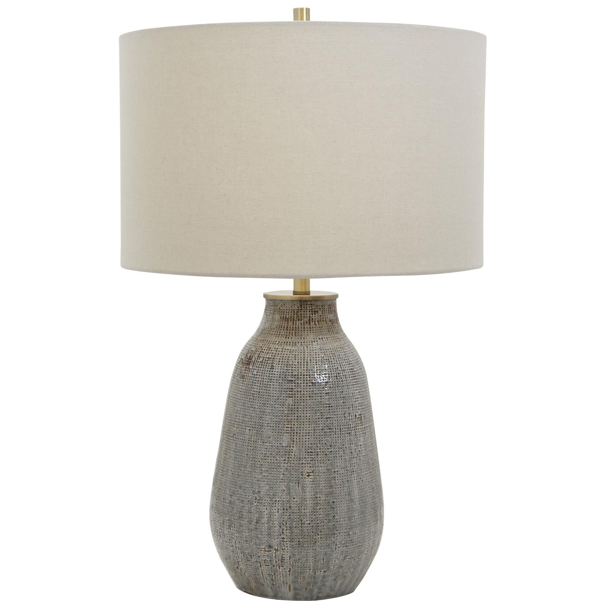 Shown in Exhibiting A Handcrafted Look, This Ceramic Table Lamp Features A Textured Finish Reminiscent Of Wov finish and Round Hardback Drum shade