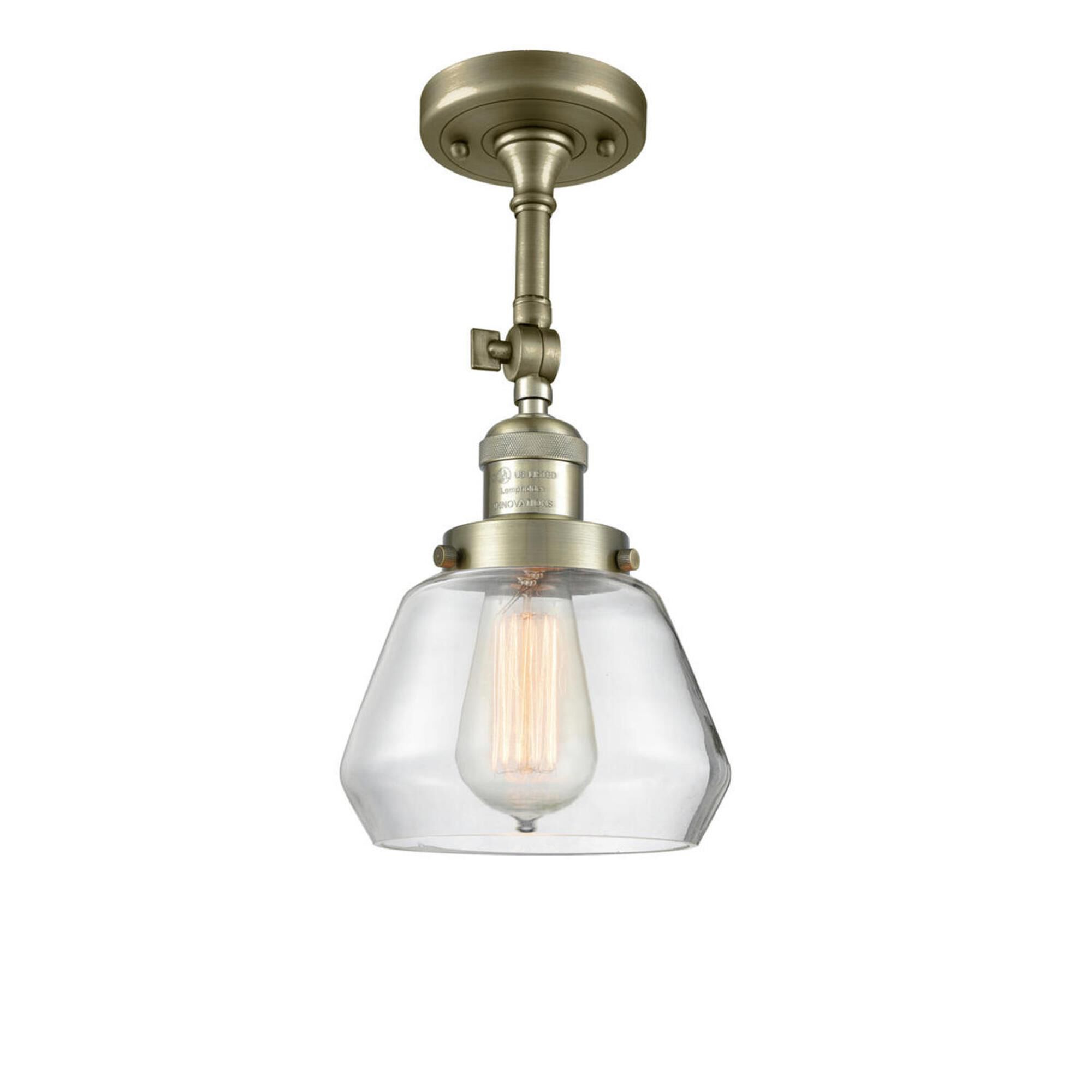 Shown in Antique Brass finish and Clear glass and None accent
